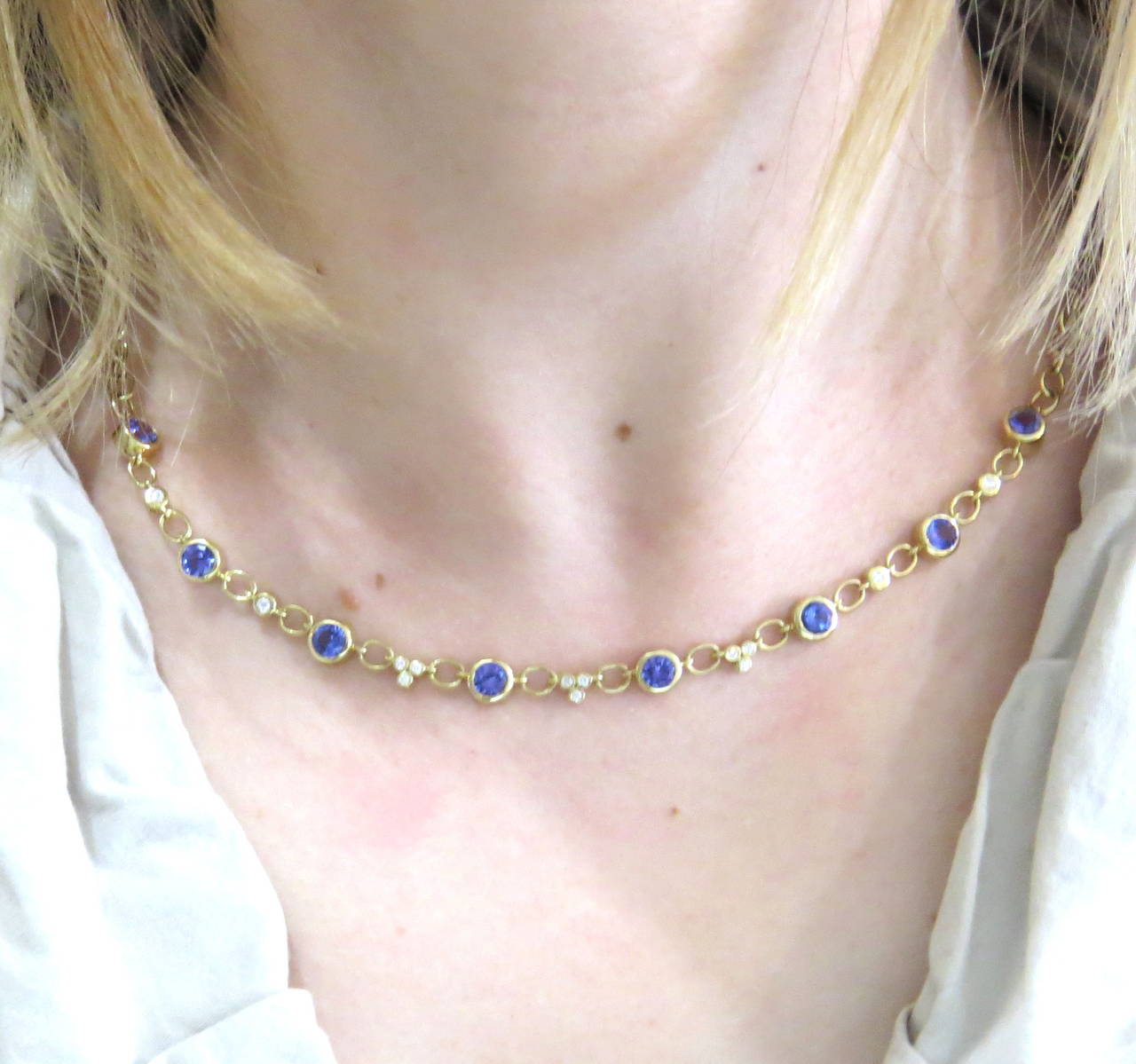 18k gold necklace by Temple St. Clair from Bellina collection, featuring round tanzanite gemstones and approx. 0.47cte in G/VS diamond spacers. Necklace is 19