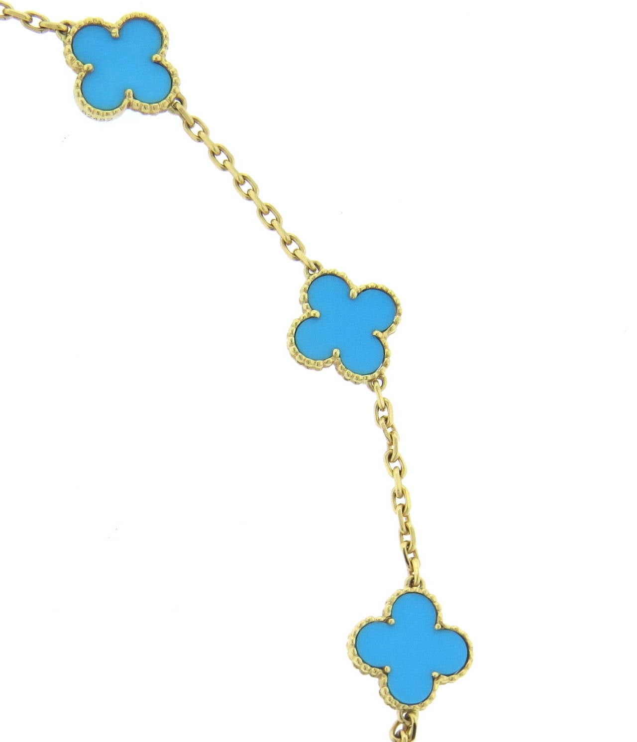 An 18k yellow gold necklace set with 10 turquoise alhambra clovers.  The necklace weighs 21.0 grams and measures 16.5