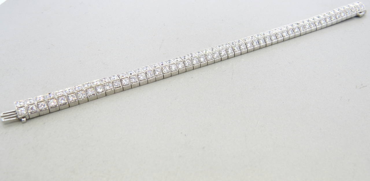 An 18k white gold bracelet set with approximately 7.50ctw of G/VS diamonds.  The bracelet is 7