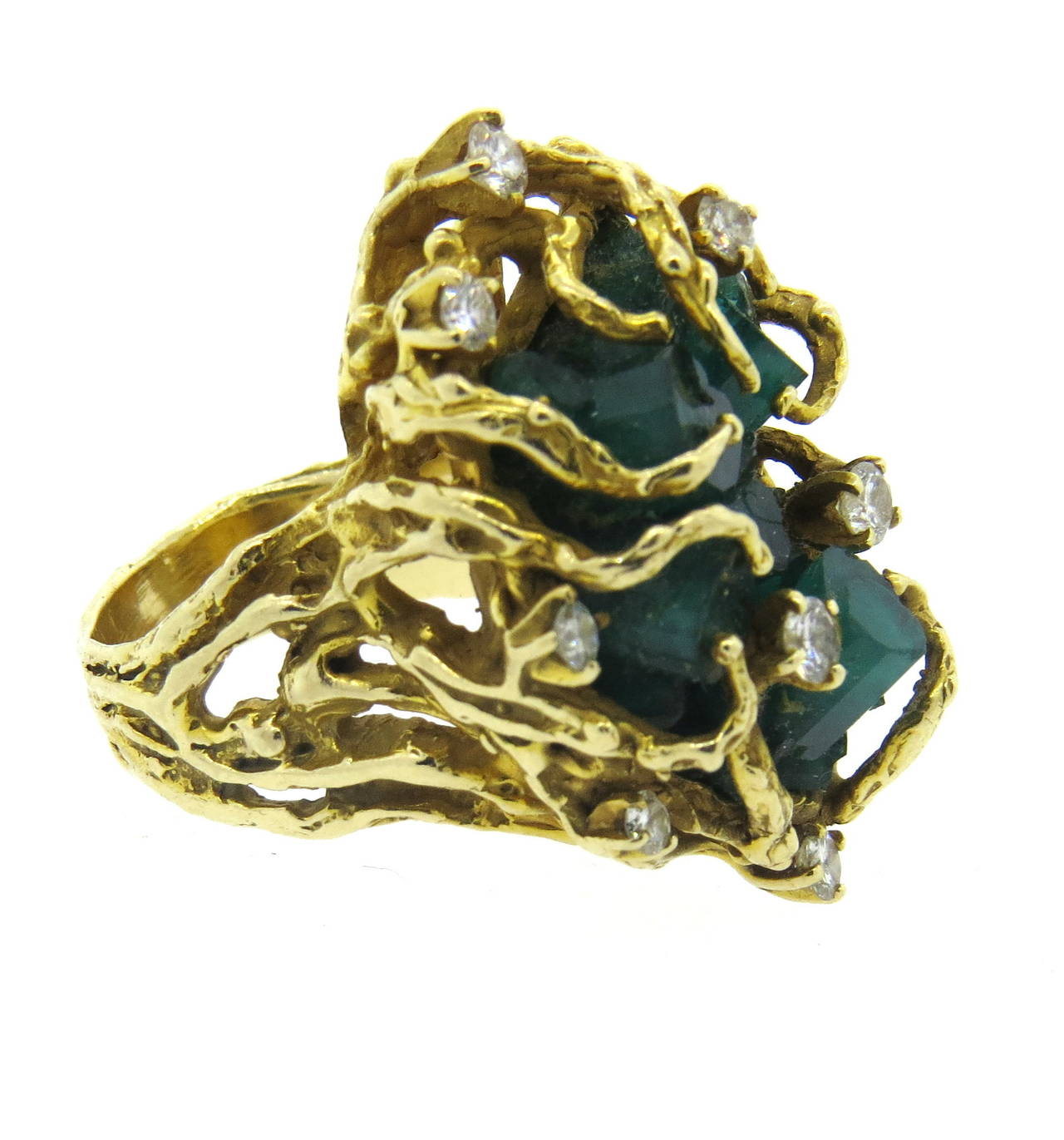 Vintage 14k gold free form ring, featuring Chatham emeralds and approx. 0.50ctw in VS-SI/H diamonds. Ring is a size 7 1/2, ring top is 32mm x 22mm, sits approx. 14mm from the top of the finger. Weight of the piece - 23.8 grams