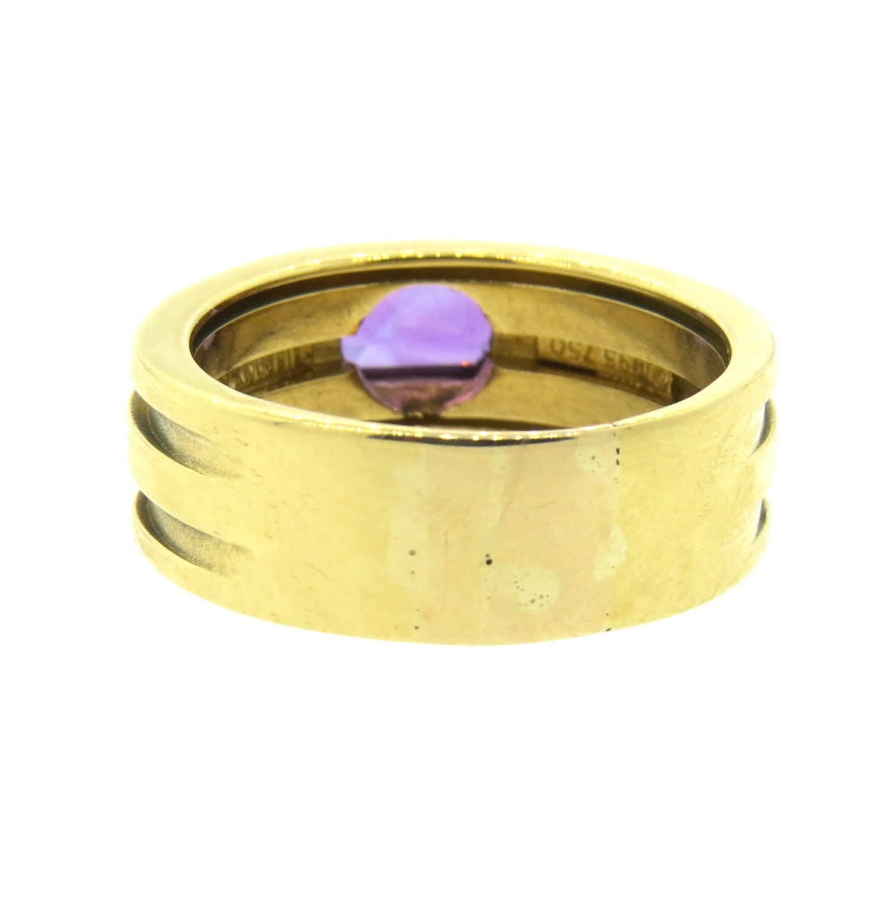 18k gold ring by Tiffany & Co, featuring amethyst gemstone. Ring is a size 9 1/2 and is 7.8mm wide. Marked Tiffany & Co,1995 and 750. Weight - 12.1 grams