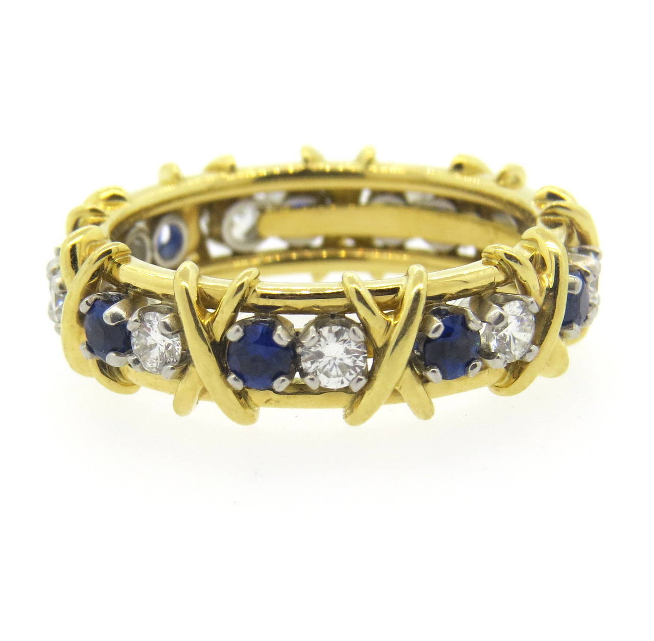 18k gold and platinum ring by Jean Schlumberger for Tiffany & Co. from Sixteen Stone collection. Ring featuring approx. 0.59ctw in G/VS diamonds and 0.75ctw in sapphires. Ring is a size 9 and is 6.8mm wide. Marked Tiffany & Co., Schlumberger