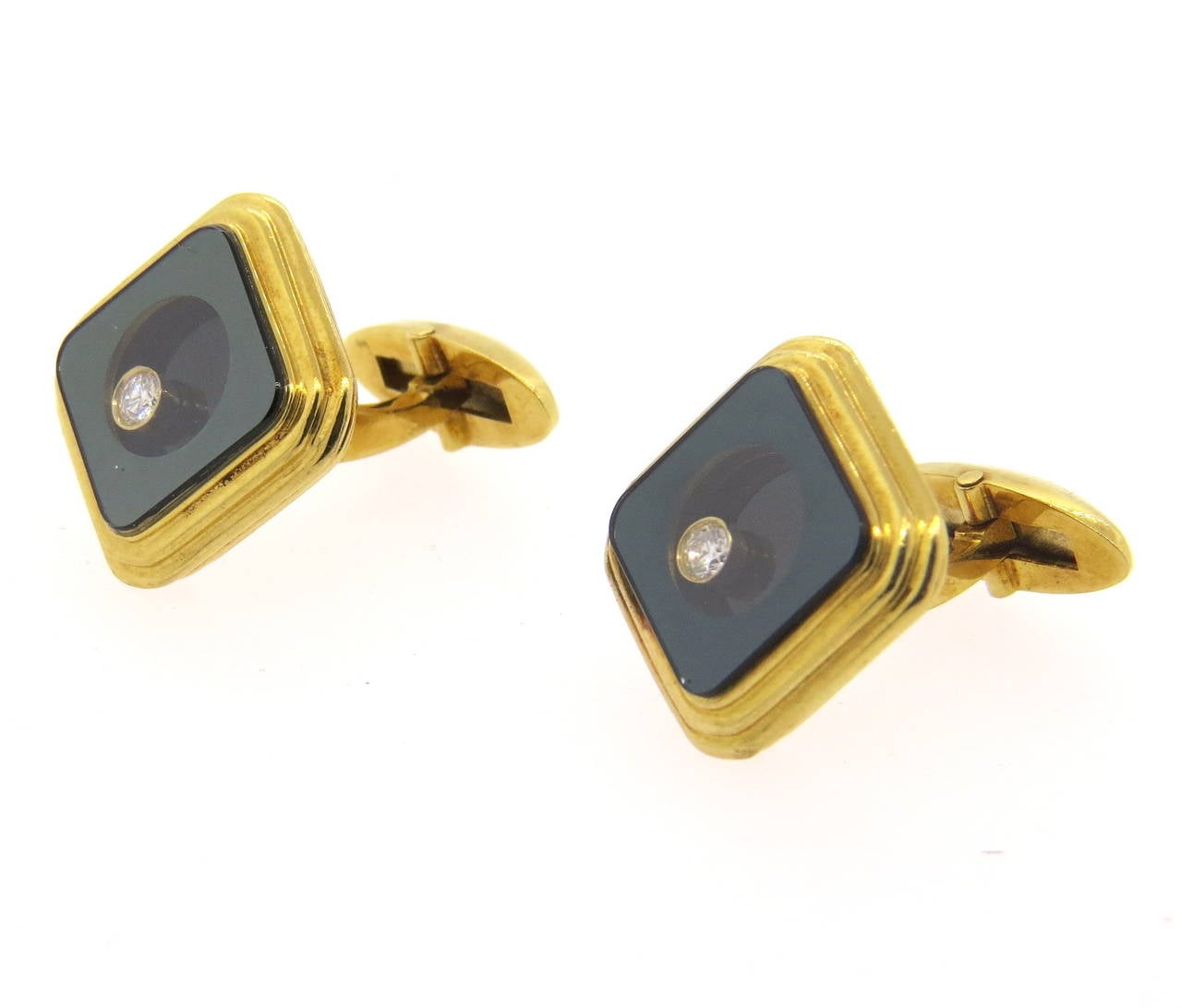 18k gold cufflinks, featuring floating diamonds in the center, approx. 0.05ct VS/G each. Cufflink top measures 16mm x 16mm. Weight - 22.4 grams