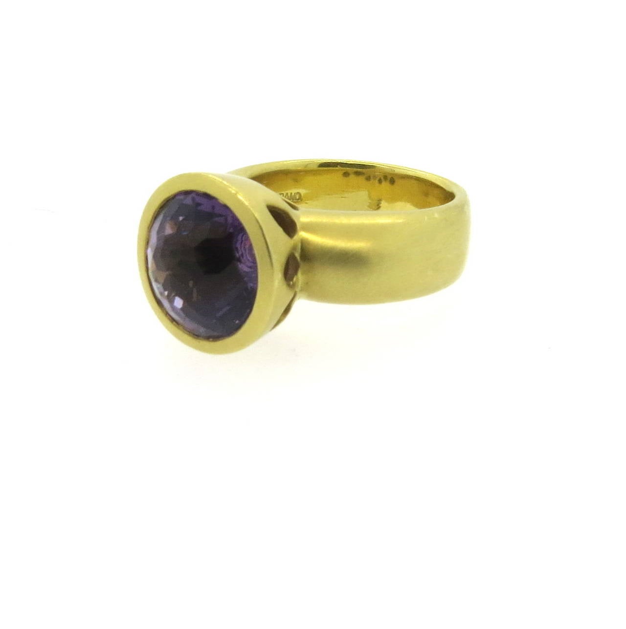 18k gold ring by Elizabeth Rand, featuring 12.8mm amethyst stone. Ring is a size 10, ring top is 15mm.  Marked 18k and E.Rand. Weight - 26.1 grams