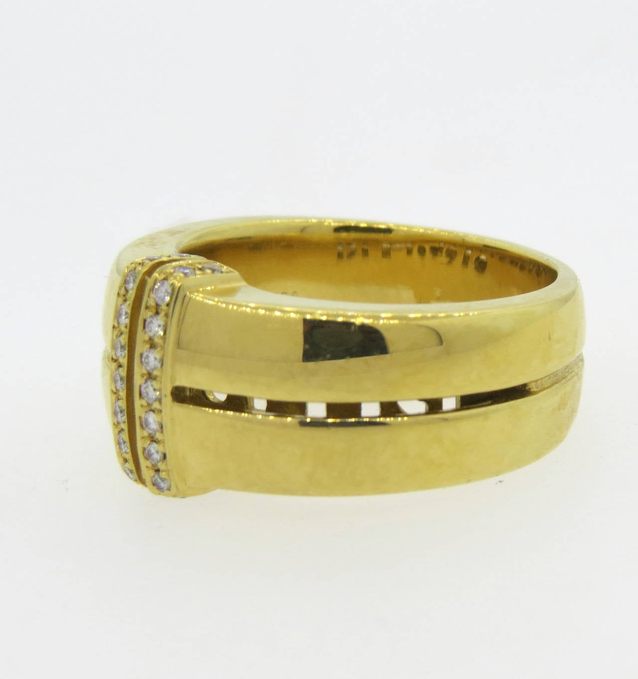 An 18k yellow gold ring set with approximately 0.11cts in G/VS diamonds.  Crafted by Di Modolo, the ring is a size 9 and weighs 17.9 grams. Marked: Di Modolo, 750