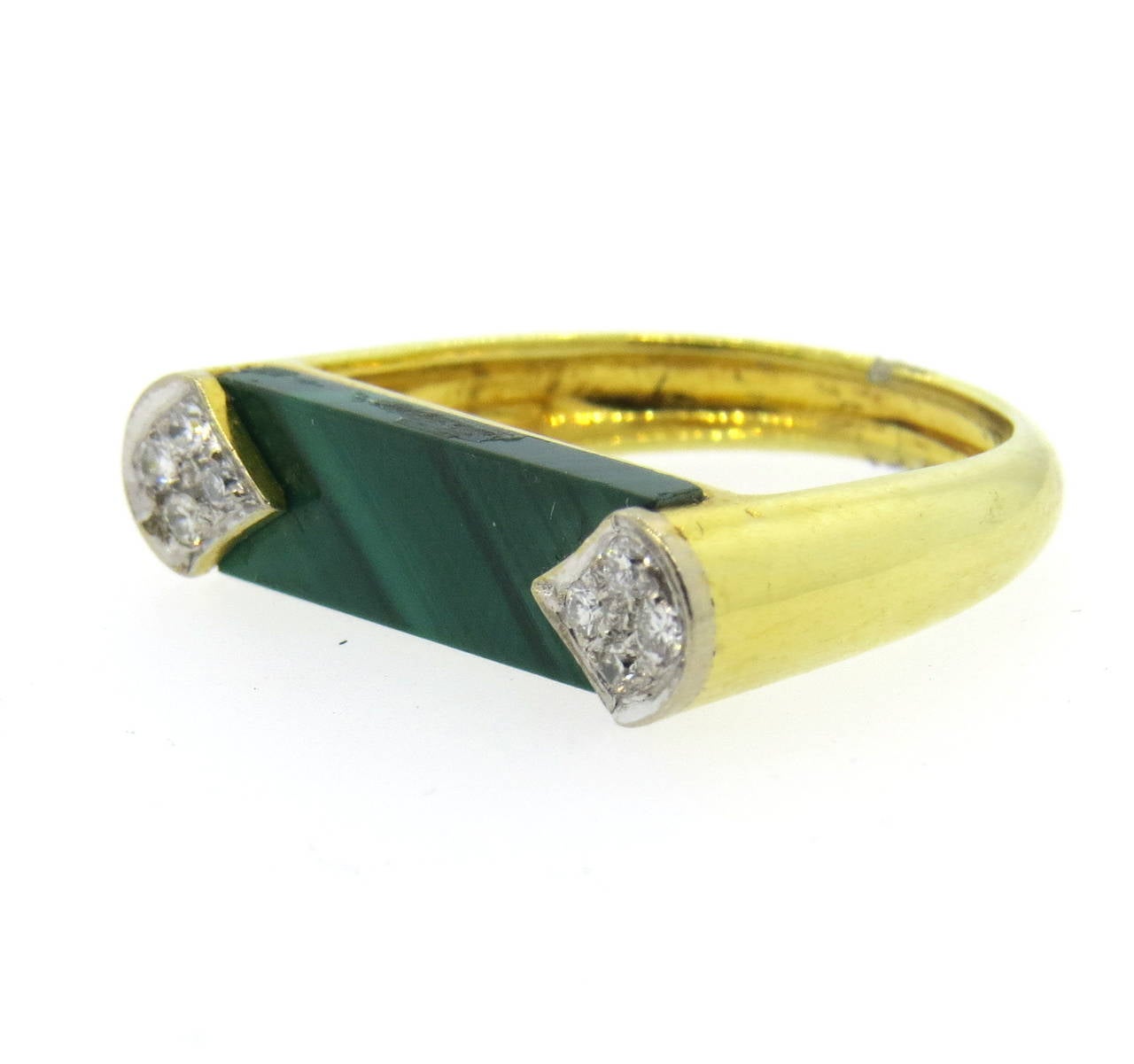 Circa 1970s 18k gold ring, featuring malachite, decorated with approx. 0.14ctw. Ring is a size 6, ring top is 22mm x 6mm. Weight - 5.8 grams