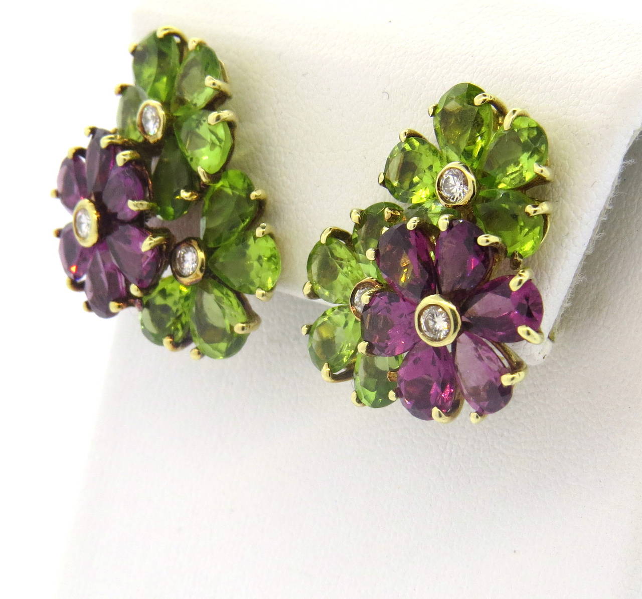 A pair of 14k yellow gold earrings, set with Peridot, Amethyst and approx.  0.40 -0.46ctw in G/VS diamonds.  The earrings measure 28mm x 22mm and weigh 17 grams.