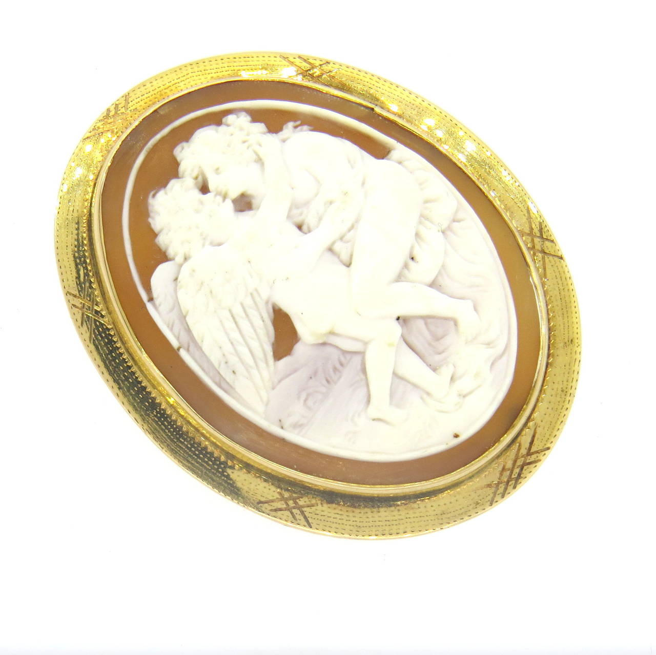 A 10k yellow gold shell cameo brooch that also has an adjustable bale to be worn as a pendant.  The brooch measures 54mm x 43mm and weighs 14.2 grams.