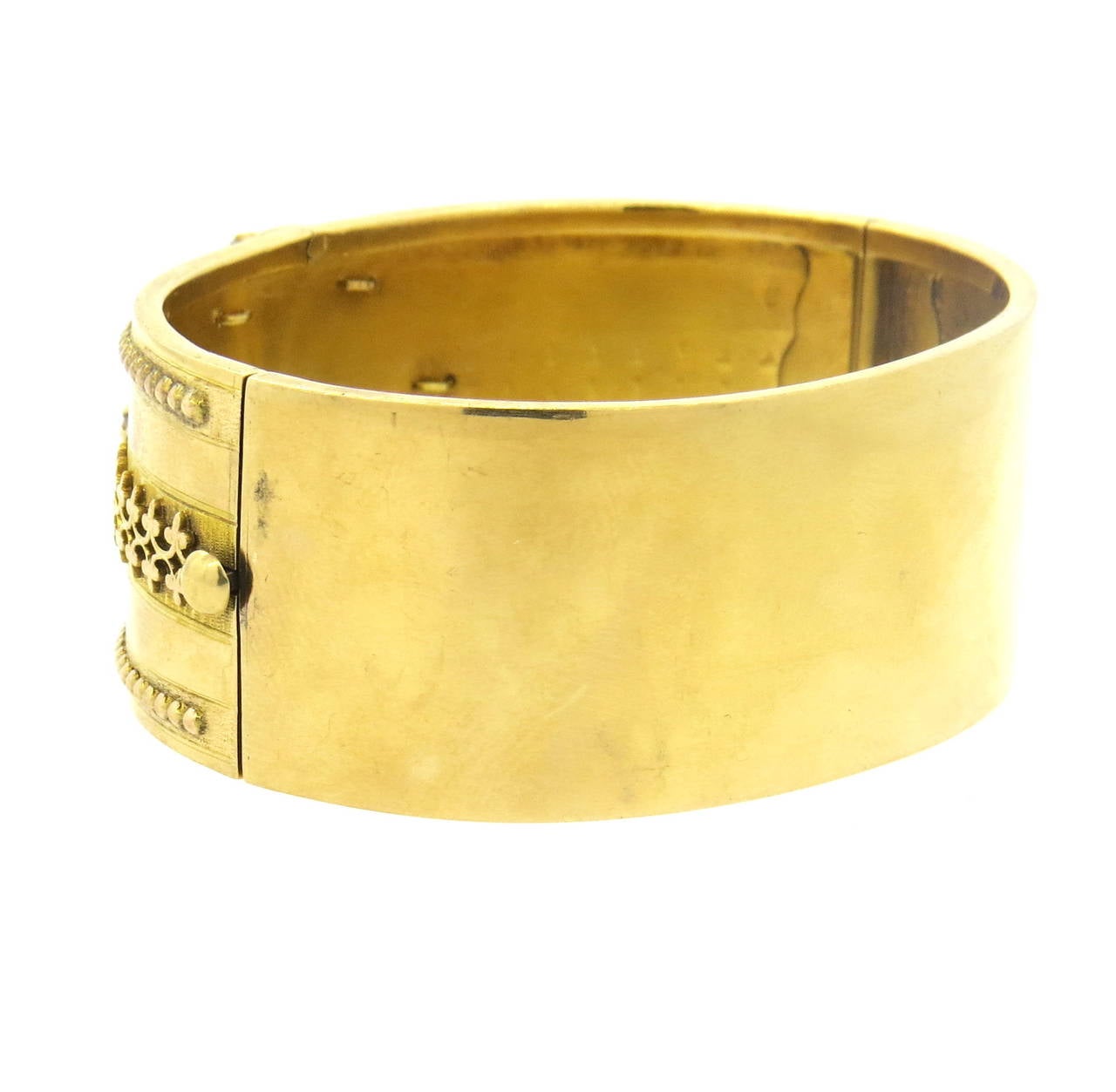 Victorian 14k gold bangle bracelet, adorned with rose cut diamonds and black enamel. Bangle will fit up to 7