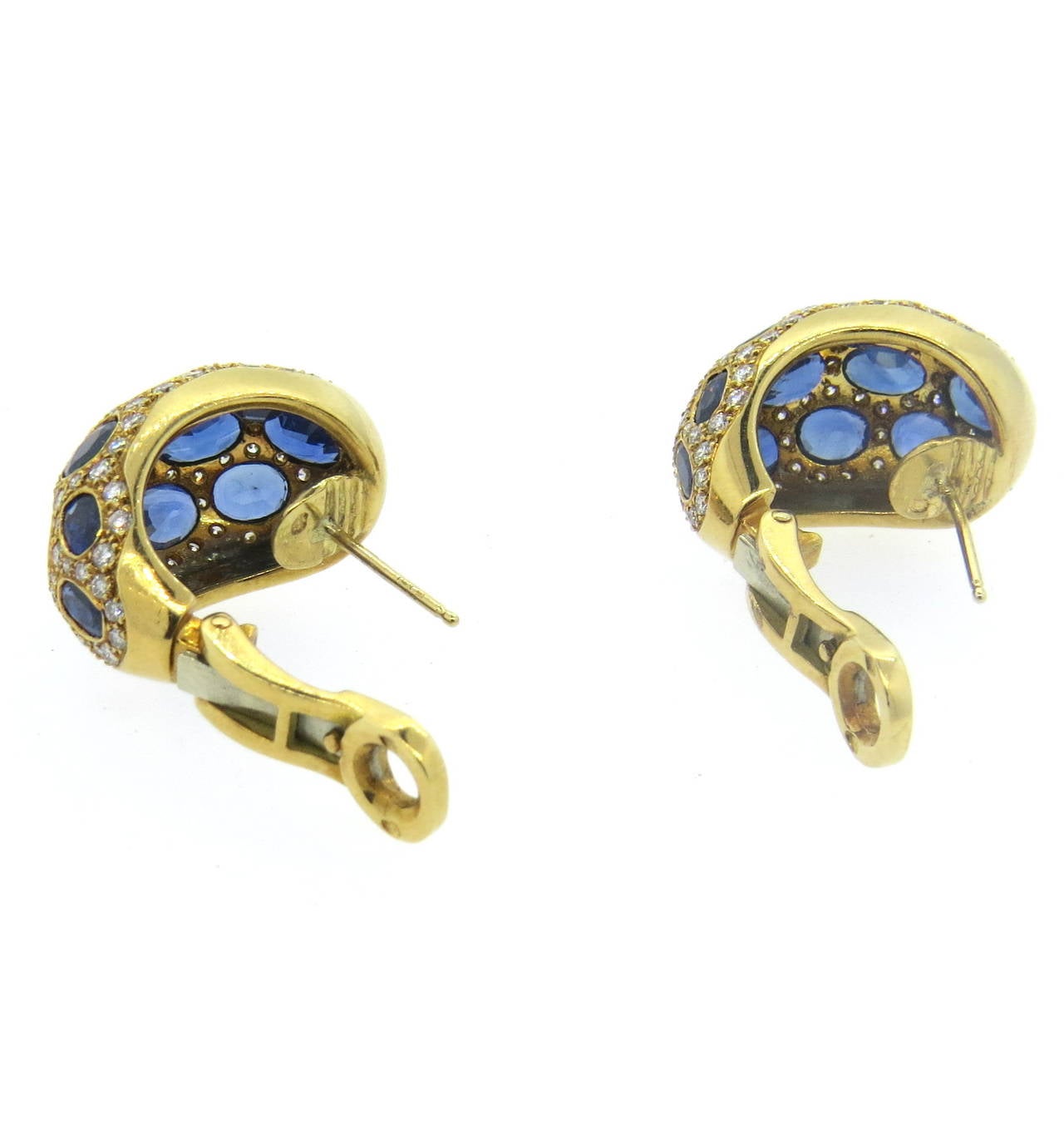 A pair of 18k yellow gold earrings, set with approximately 9 carats in sapphires and 1.85cts in G/VS diamonds.  Crafted in France, the earrings measure 30mm x 14.5mm and weigh 21.7 grams.