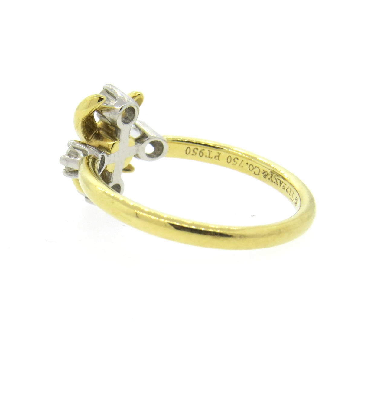 Tiffany & Co 18k gold and platinum ring from Lynn collection, designed by Jean Schlumberger, crafted with 0.20ctw in diamonds. Ring is a size 6, top measures 10.6mm x 11mm. Marked Schlumberger Studios, Tiffany & Co,750,pt950. Weight of the piece -