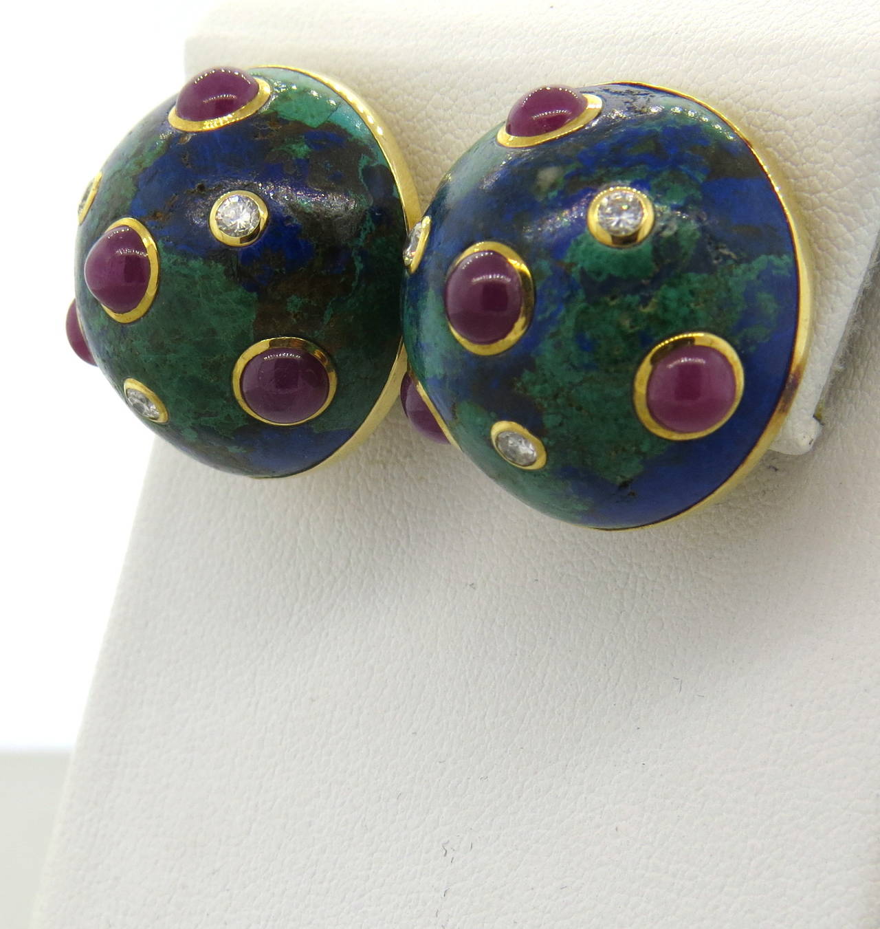18k gold Trianon earrings, featuring azurite top, adorned with ruby cabochons and approx. 0.36ctw in G/VS diamonds. Earrings are 23mm in diameter. Marked 18k and Trianon. Weight - 32.5 grams