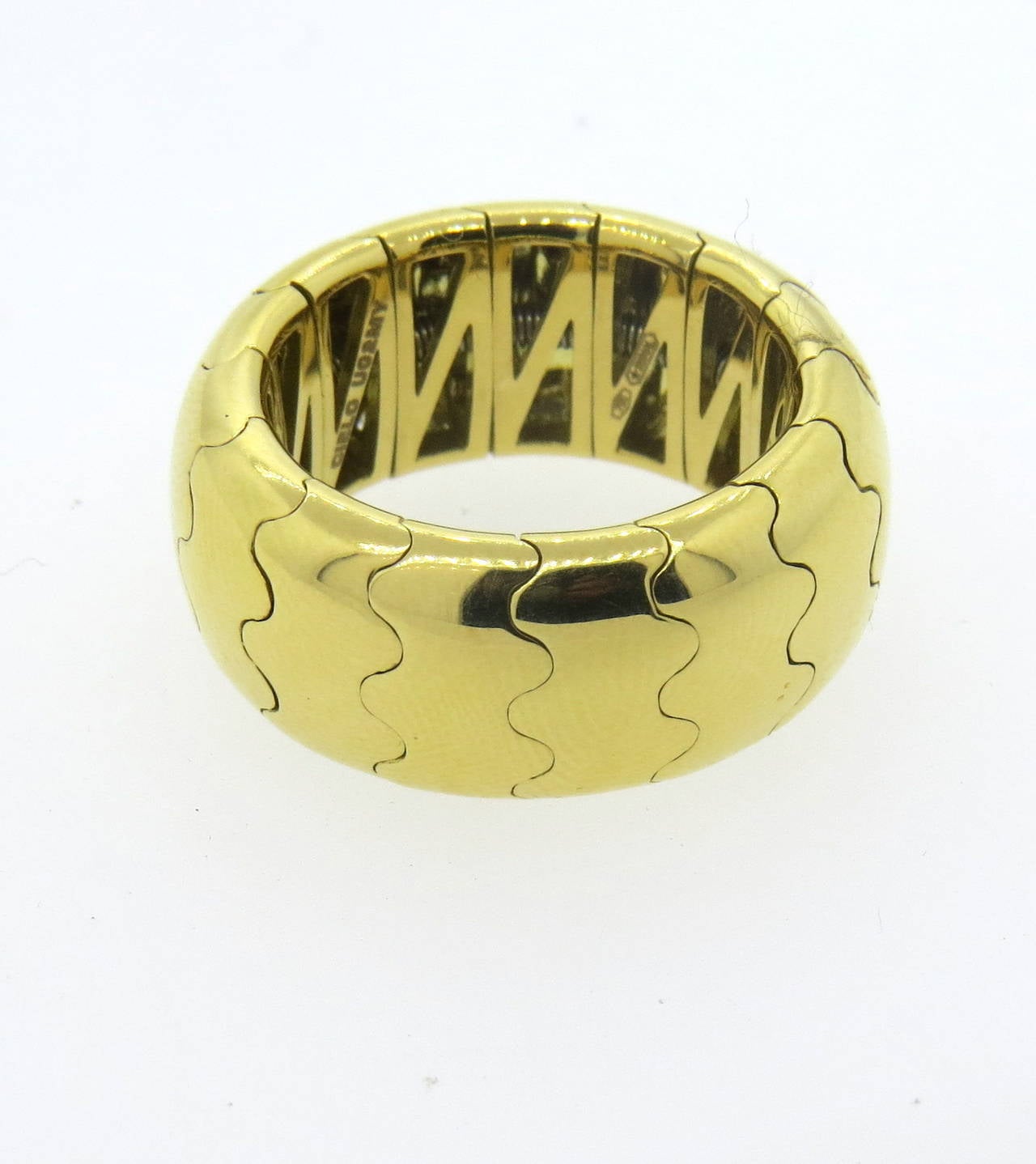 18k gold flexible band ring by Mattia Cielo from Universo collection. Ring is a size 6 (slightly flexible) and is 10mm wide. Marked Cielo U02MY, 750 and Italian mark. Weight of the piece - 16.6 grams
Retails for $3100