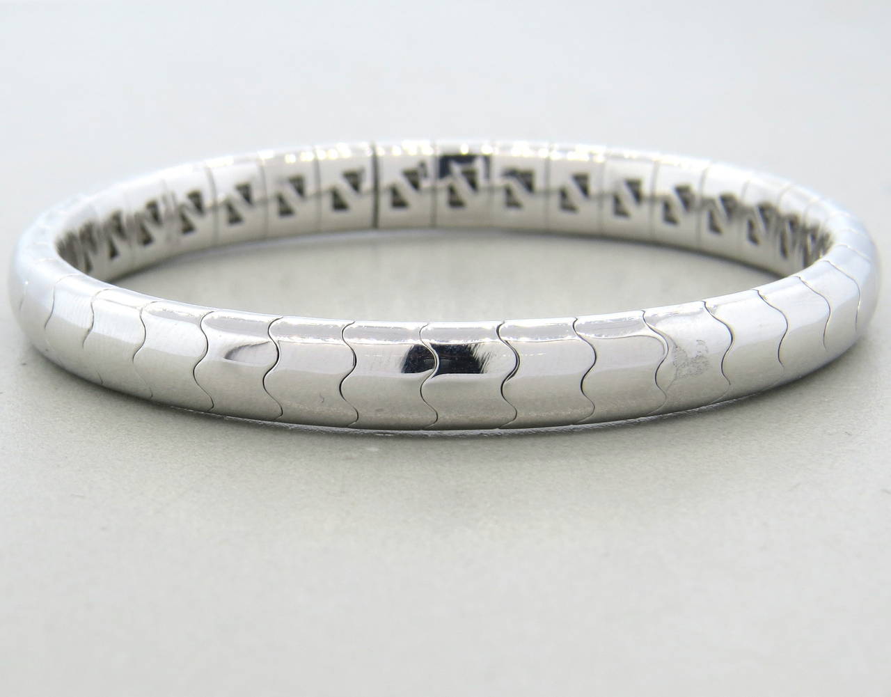 18k white gold flexible bangle bracelet by Mattia Cielo. Bracelet will fit up to 6