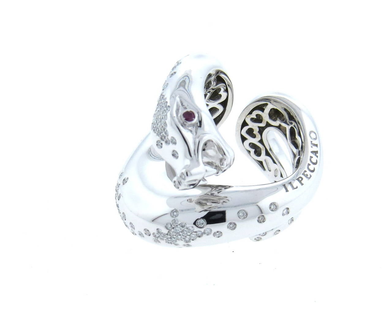 Pasquale Bruni 18k white gold snake ring from Il Peccato collection, set with approx. 0.93ctw in diamonds and two ruby eyes. Ring is a size 6 1/2, ring top is 28mm wide. Marked Pasquale Bruni,Il Peccato, 750 and Italian hallmark. weight of the piece