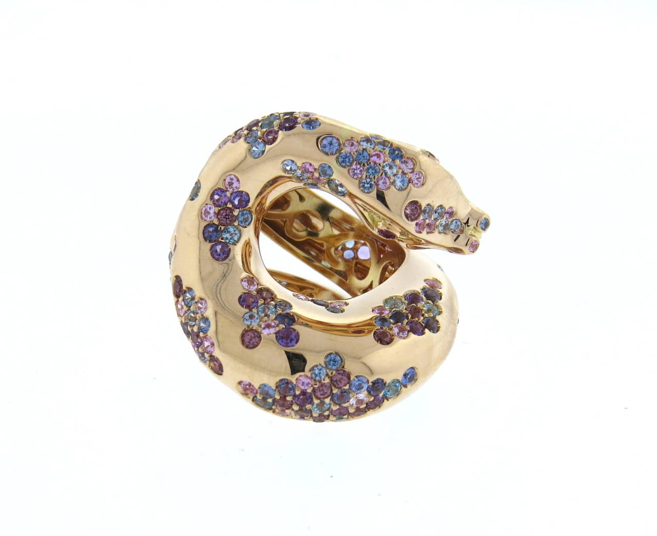 Pasquale Bruni 18k rose gold snake ring from Il Peccato collection, adorned with approx. 1.76ctw in multicolor sapphires and two ruby eyes. Ring is a size 7 1/2, ring is 27mm wide. Marked Pasquale Bruni,Il Peccato, 750 and Italian hallmark. Weight -