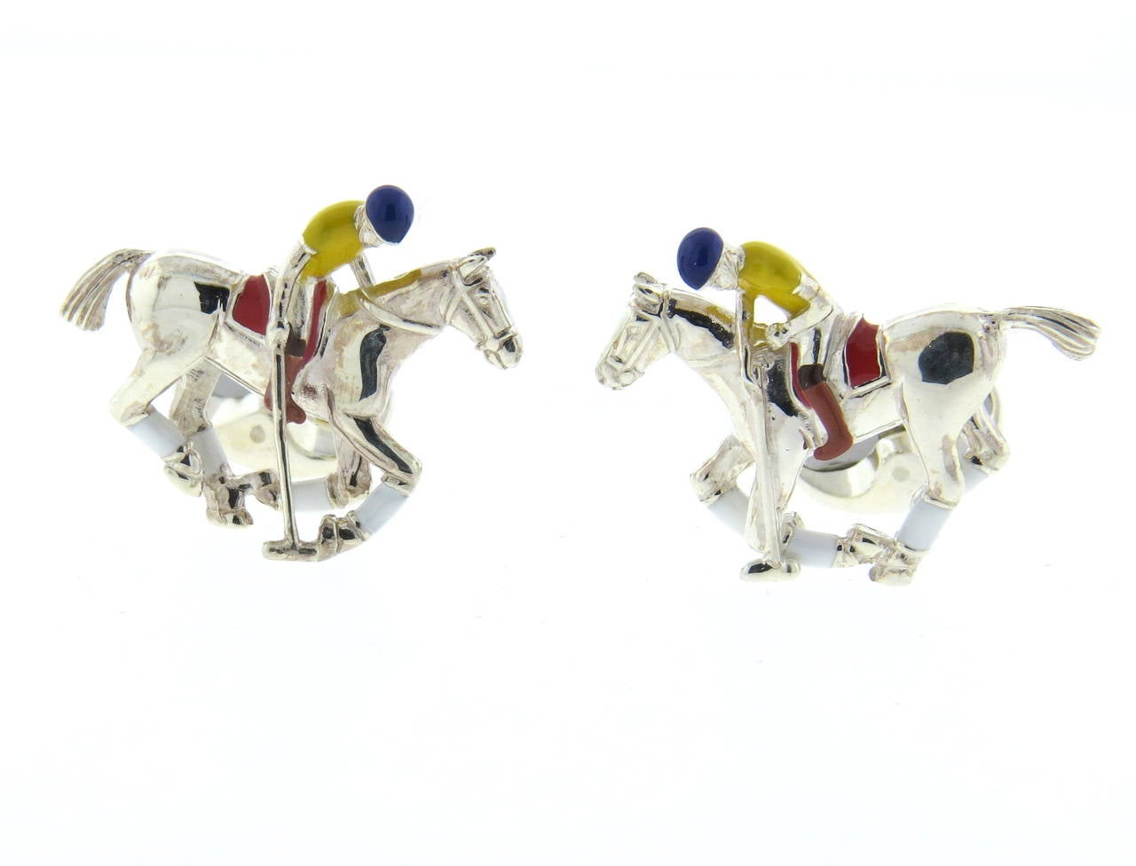 Brand new pair of Deakin & Francis sterling silver cufflinks, featuring enamel decorated pony rider and a pony. Top measures 28mm x 25mm. Marked Deakin & Francis, 925. Weight - 26.3 grams

Come with box and booklet