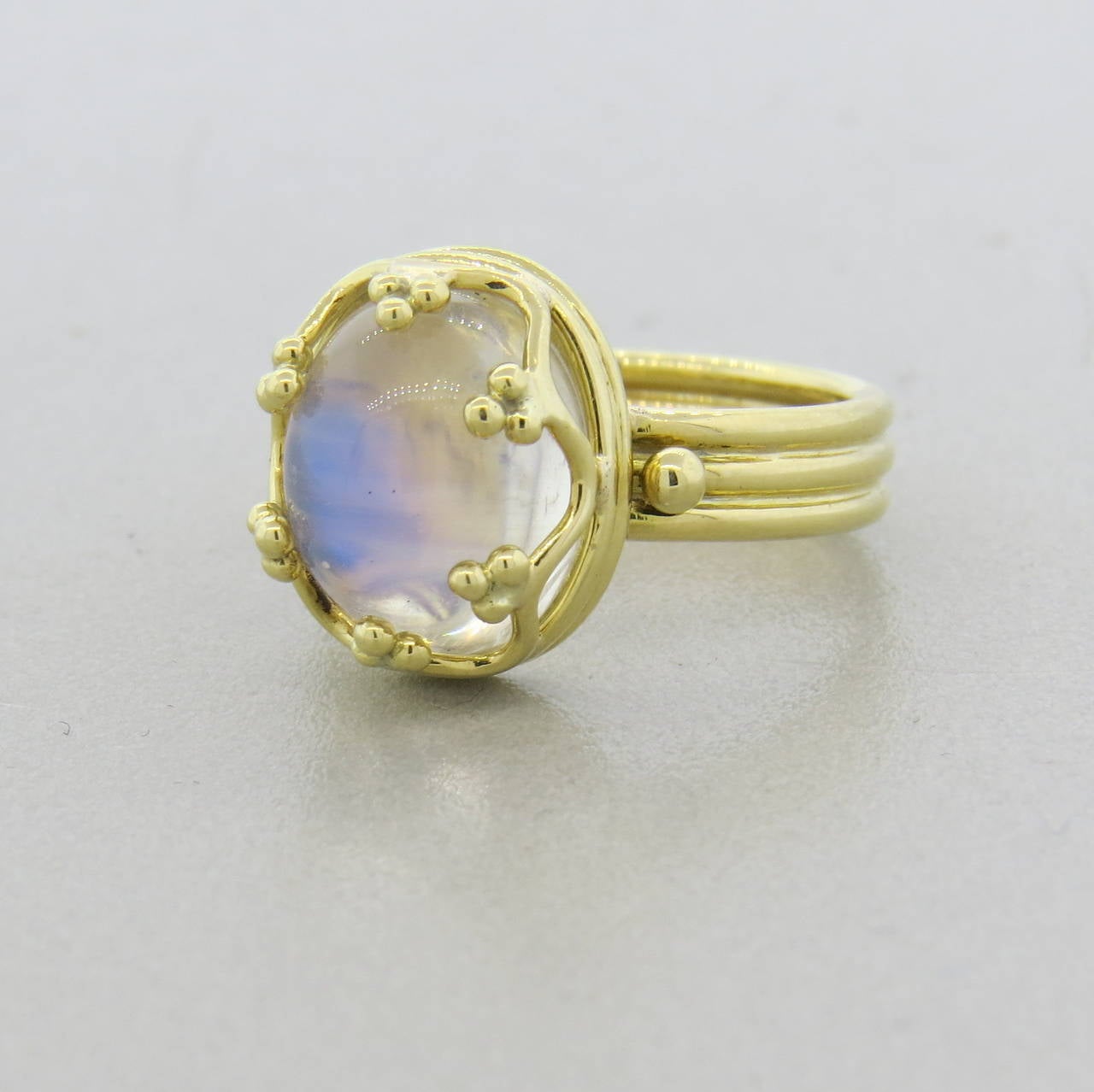 Temple St. Clair 18k gold ring, featuring oval 6ct moonstone cabochon. Ring is a size 6 1/2, ring of the ring measures 14mm x 11.5mm. Marked with Temple hallmark and 750. Weight of the piece - 7.8 grams.