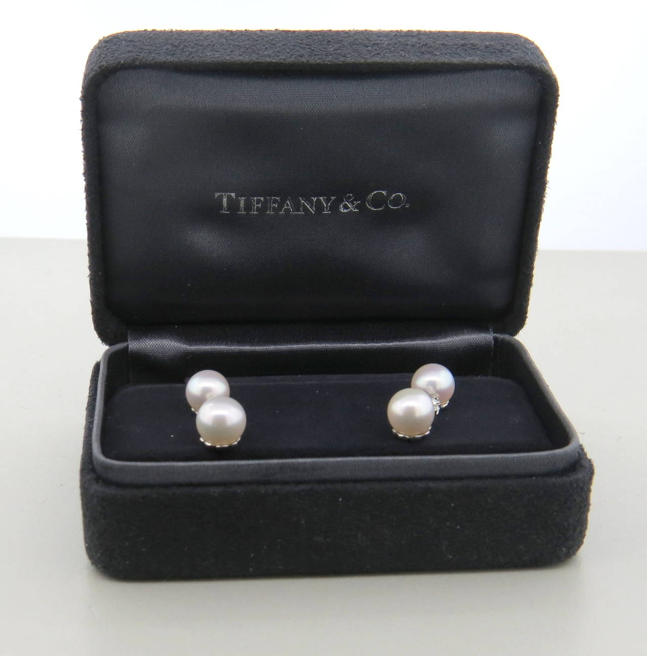 Tiffany & Co. platinum drop earrings from Aria collection, featuring 7.6mm pearls and approx. 0.27ctw in G/VS diamonds. Earrings are21mn long. Marked pt950 and T & Co. Weight - 5.5 grams.

Come in Tiffany box, currently retail for $3200