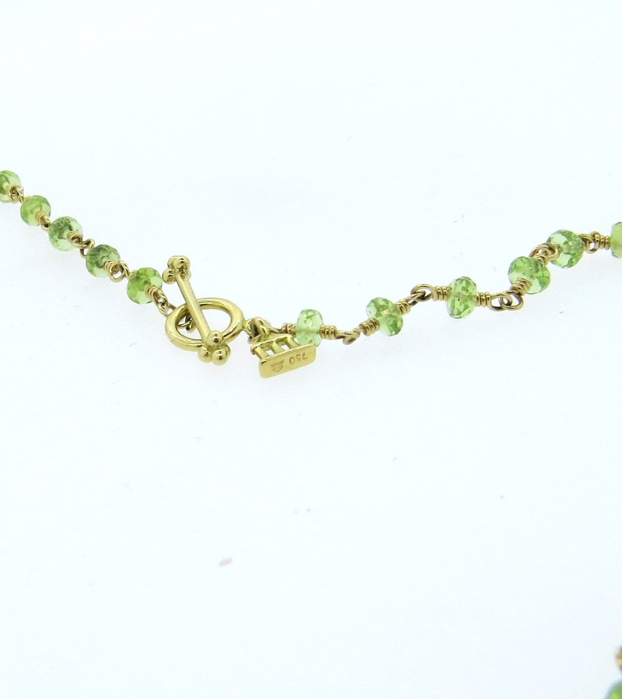 18k gold necklace by Temple St. Clair from Karina collection, featuring peridot beads. Necklace is 24