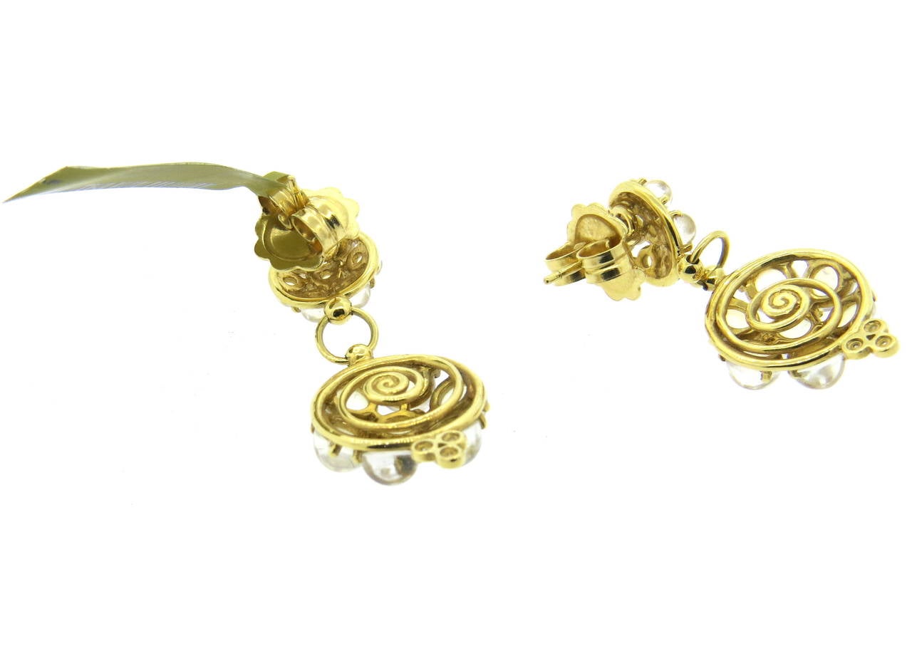 Temple St. Clair 18k gold drop earrings, set with 0.09ctw diamonds and moonstone cabochons. Earrings measure 35mm x 15mm. Marked with Temple hallmark and 750. Weight - 10.3 grams
