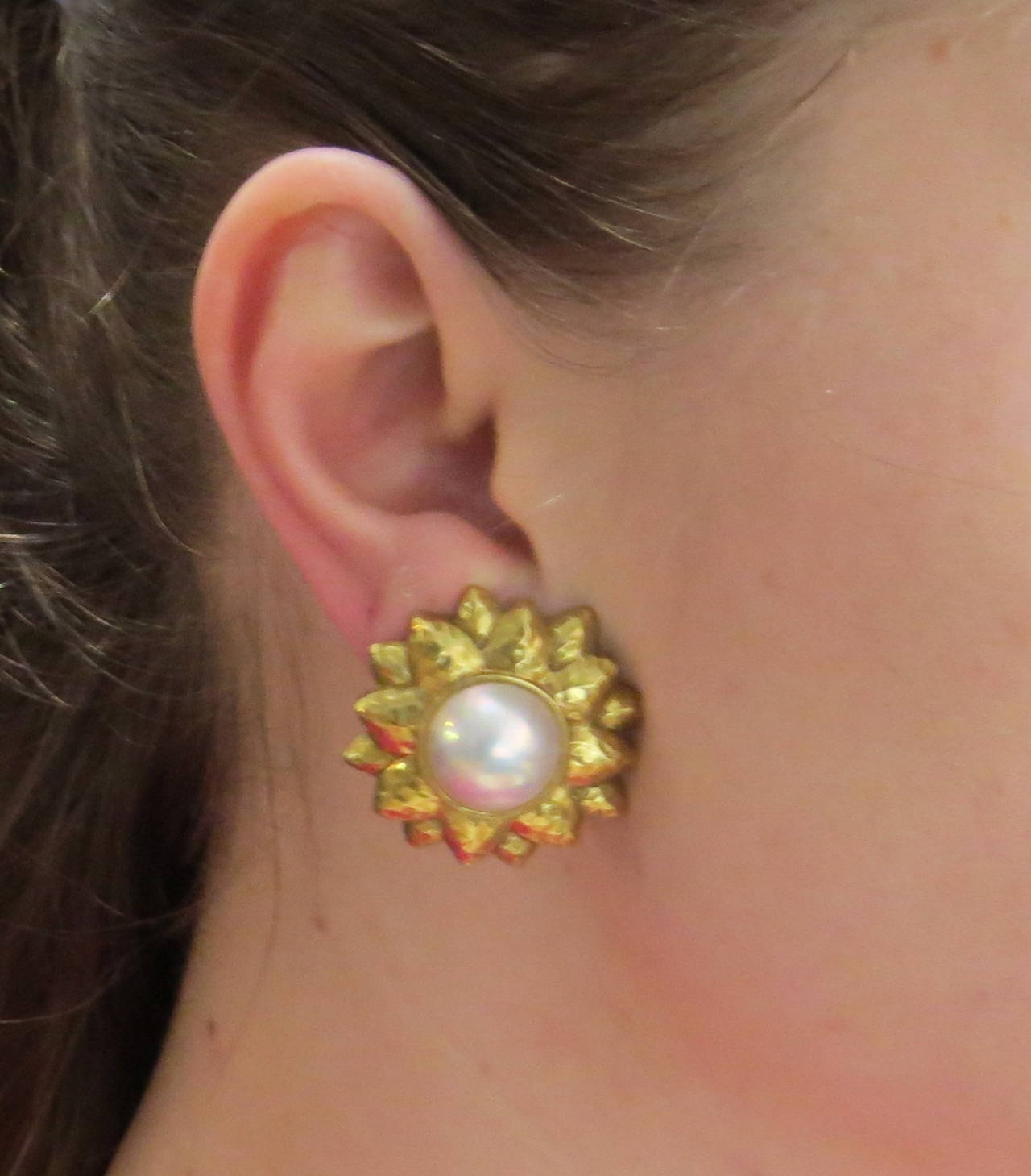 18k hammered gold earrings, set with 13.8mm mabe pearls, featuring sunflower design. Earrings measure 30mm in diameter. Weight - 31.9 grams