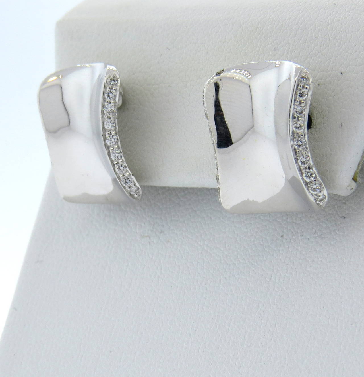 A pair of 18k white gold earrings, set with approximately 0.32ctw in G/VS diamonds.  Crafted by Robert Lee Morris, the earrings measure 17mm x 15mm and weigh 9.6 grams.  Marked: Robert Lee Morris, 18k