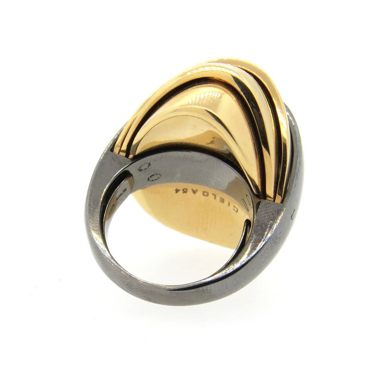 18k gold two tone ring by Mattia Cielo from Armadillo collection, featuring movable top. Ring is a size 6 3/4, ring top is 28m wide, ring sits approx. 18mm from the finger. Marked 750,Italian gold mark and CIelo A54. Weight - 27.8 grams.