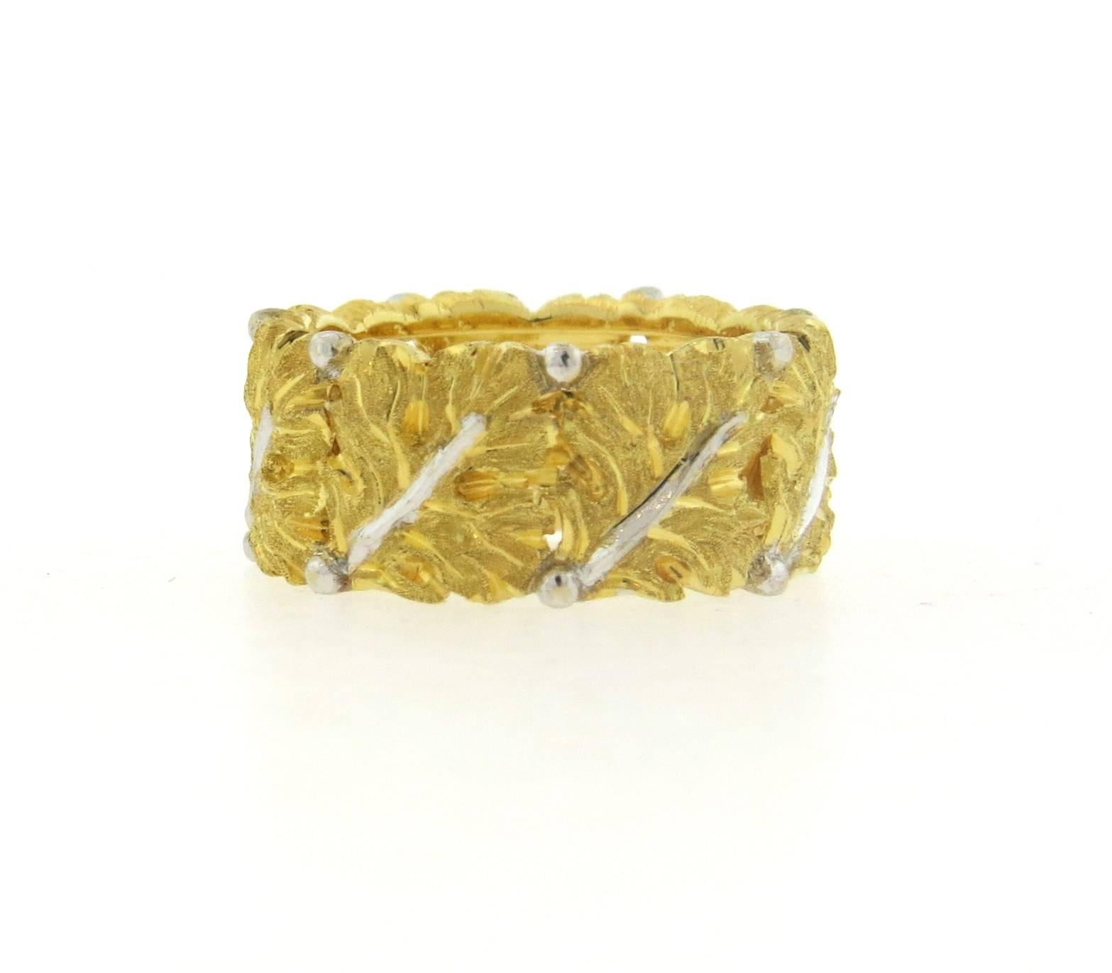 An 18k yellow gold wide leaf motif band ring, crafted by Buccellati. Ring size 4 1/4, ring is 8.5mm wide. Marked: Buccellati Italy 18k. Weight of the piece - 5.8 grams 