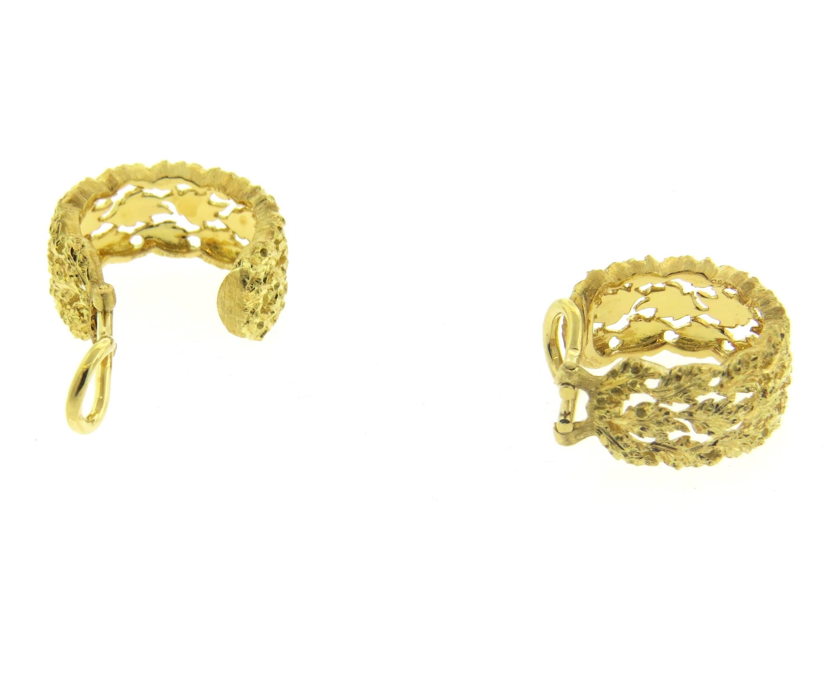 A pair of large 18k yellow gold leaf motif hoop earrings, crafted by Buccellati. Earrings are 20mm in diameter x 9mm wide. Marked:  Buccellati Italy 18k. Weight - 10.9 grams 