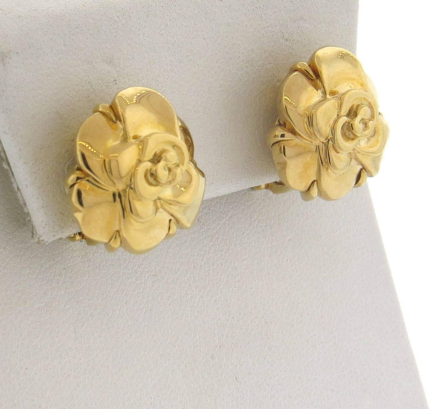 An 18k yellow gold pair of Camellia flower earrings.  Crafted by Chanel, the earrings are 16mm x 17mm.  Marked: Chanel 750, French gold assay marks, 9E100.  The weight of the earrings is 15.8 grams.