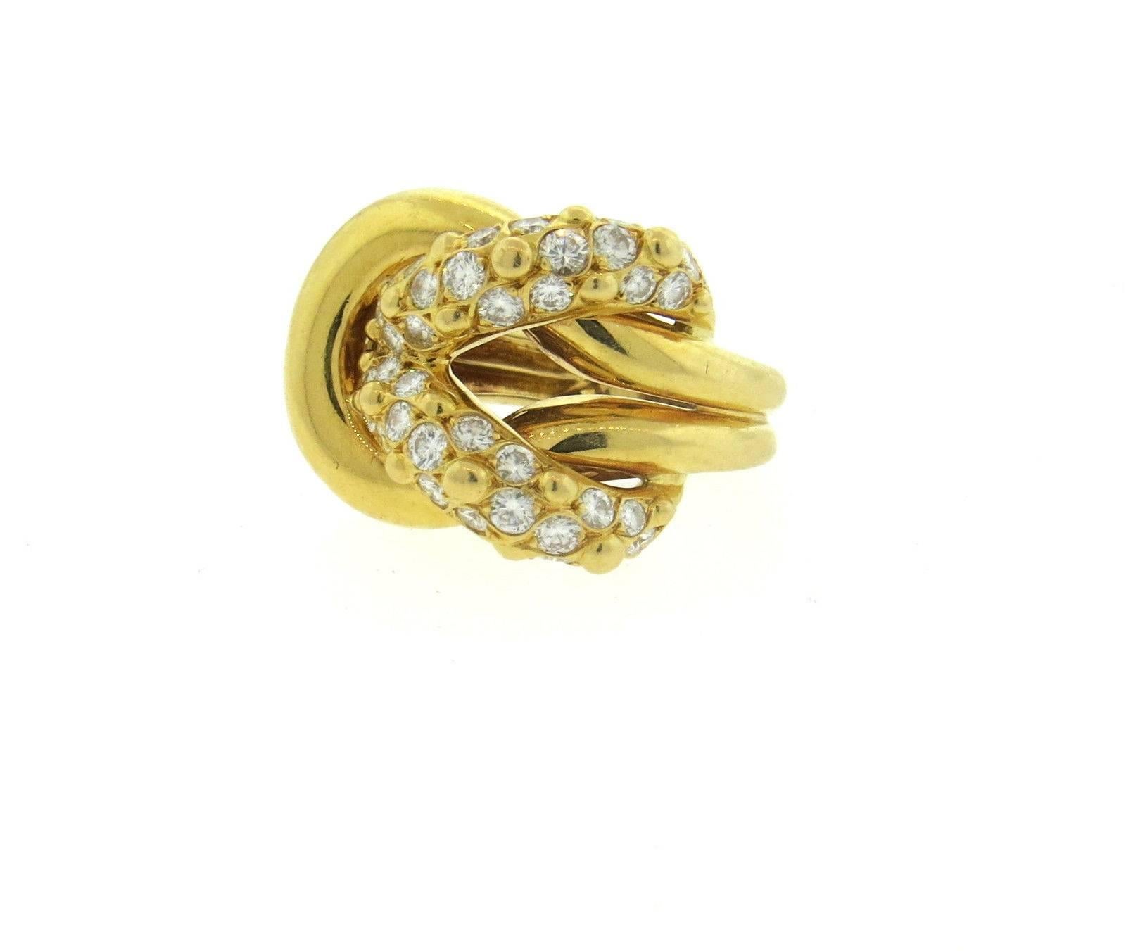 An 18k yellow gold ring set with approximately 1.20ctw of FG/VVS diamonds.  Crafted by Van Cleef & Arpels, the ring is a size 6, ring top is 19mm x 23mm.  Marked: Van Cleef & Arpels, 750, 72, 122245.  The weight of the ring is 13.5 grams.