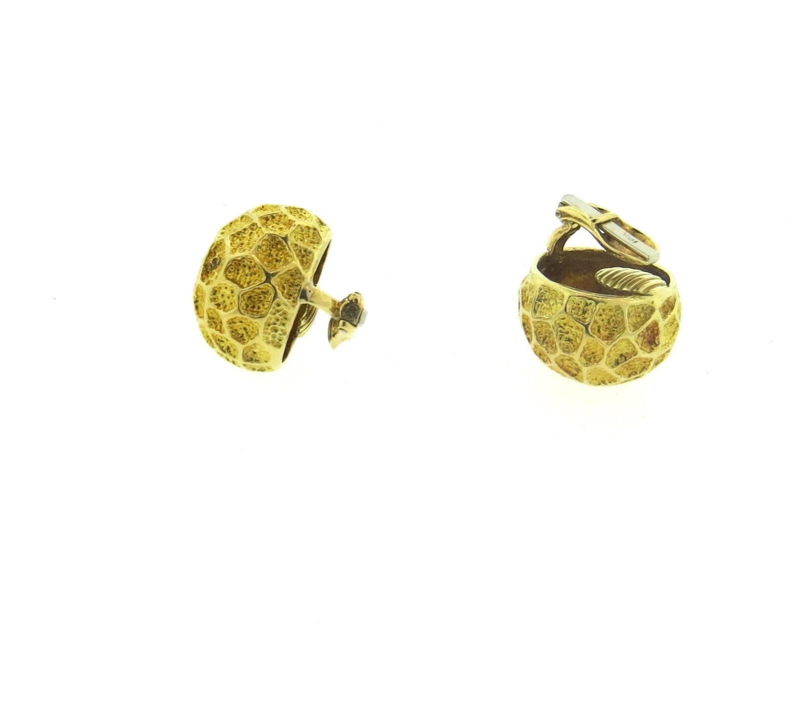 A pair of 18k yellow gold earrings designed in a honeycomb fashion.  Crafted by Tiffany & Co, the earrings measure 20mm in diameter and weigh 26.3 grams.  Marked: Tiffany & Co, 18k