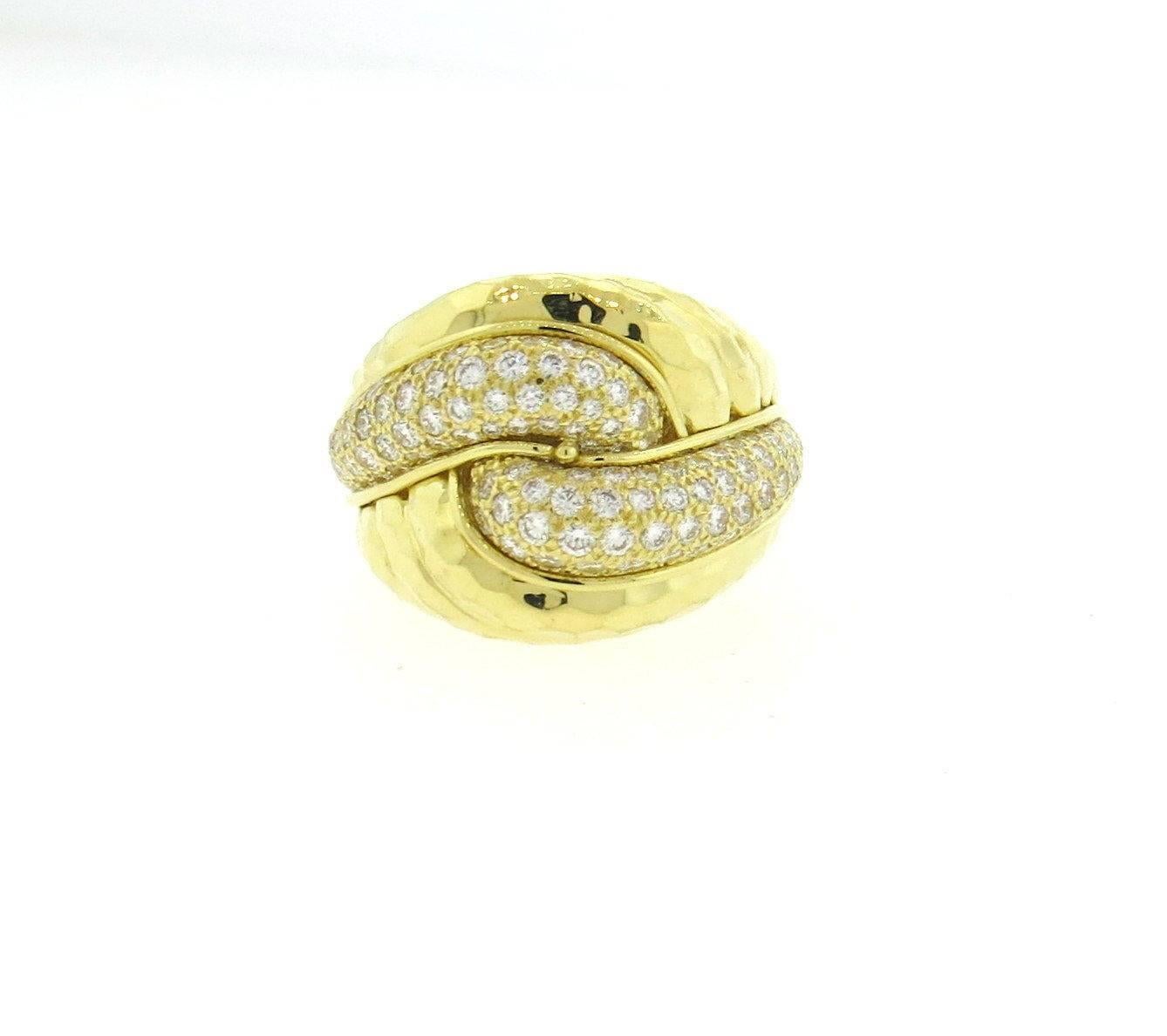 An 18k yellow gold ring set with approximately 1.50ctw of G/VS diamonds.  Crafted by Henry Dunay, the ring is a size 8, ring top is 19mm wide.  Marked:	750,Dunay 18k.  The weight of the ring is 17.9 grams.