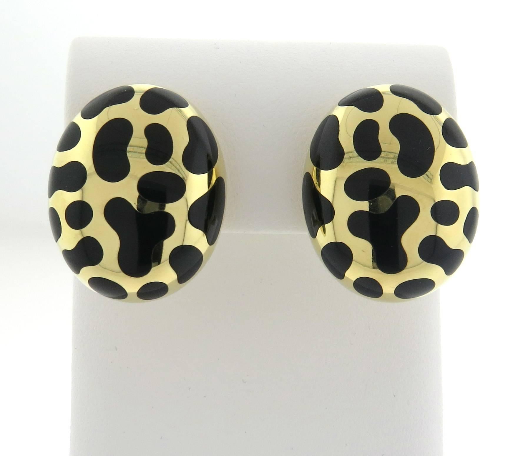 A pair of large oval 18k yellow gold earrings, crafted by Angela Cummings, featuring conic black jade inlay design. Earrings are 27mm x 22mm . Marked: Angela Cummings 750. Weight - 22.1 grams
