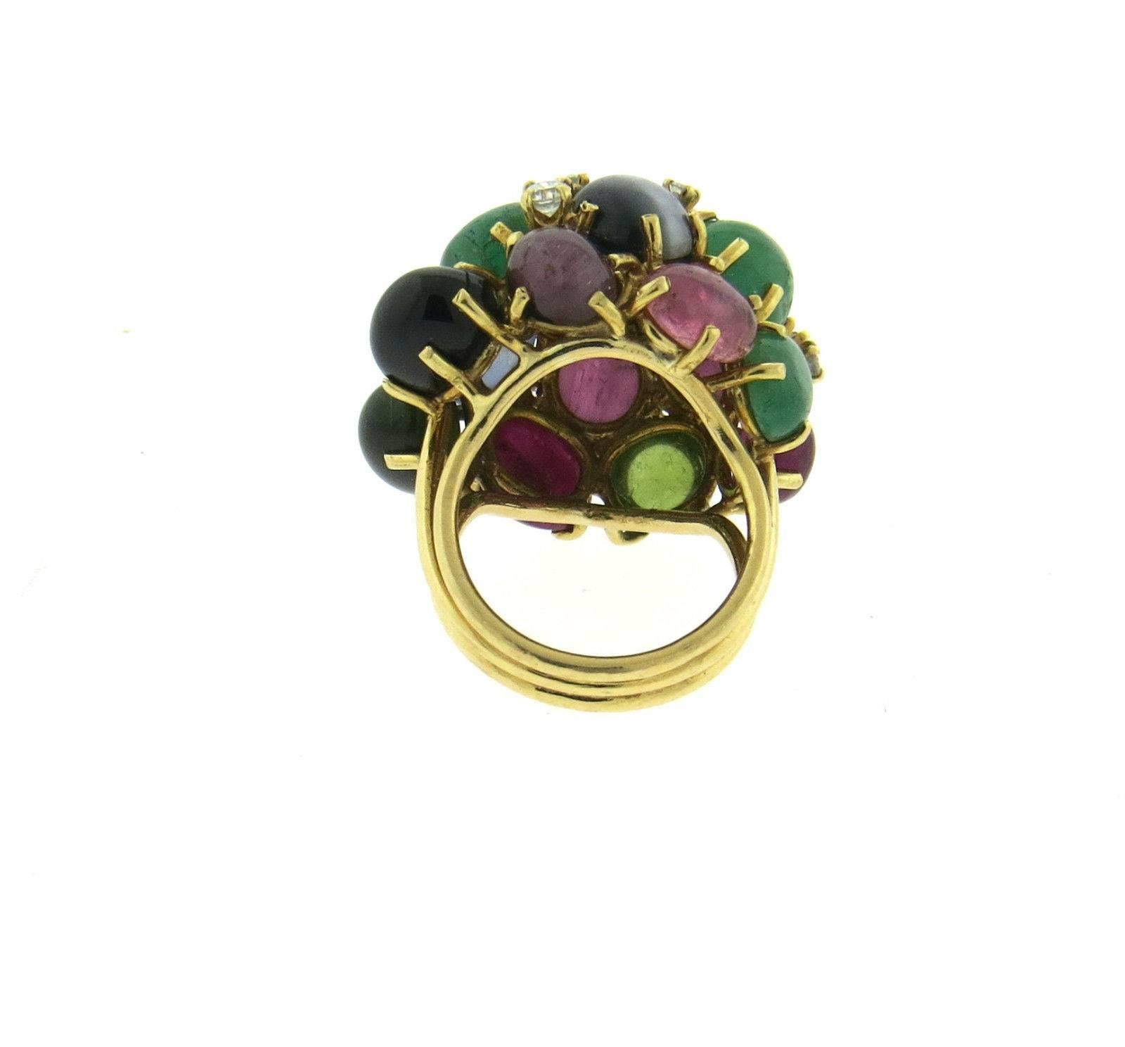 An 18k yellow gold ring set with sapphire, emerald, peridot and tourmaline cabochons along with 0.36ctw of H/VS diamonds.  The ring is a size 6, ring top is 24mm x 28mm, sits approx. 20mm from the finger.  Marked: K. Lambert.  The weight of the ring