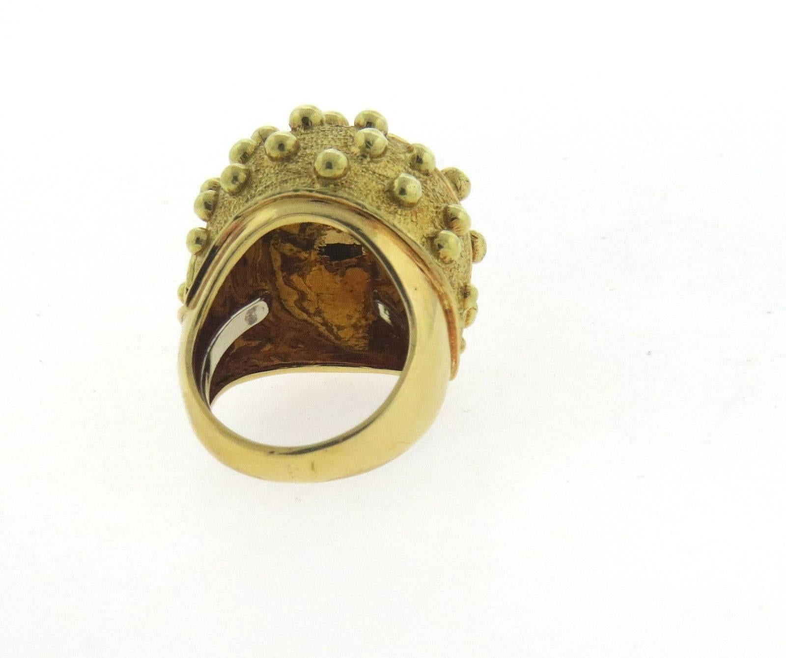 An 18k yellow gold dome ring.  Created by David Webb, the ring is a size 6, ring top is  24mm x 23mm, sits approx. 15mm from the finger.  Marked: Webb 18k.  The weight of the ring is 26.6 grams.