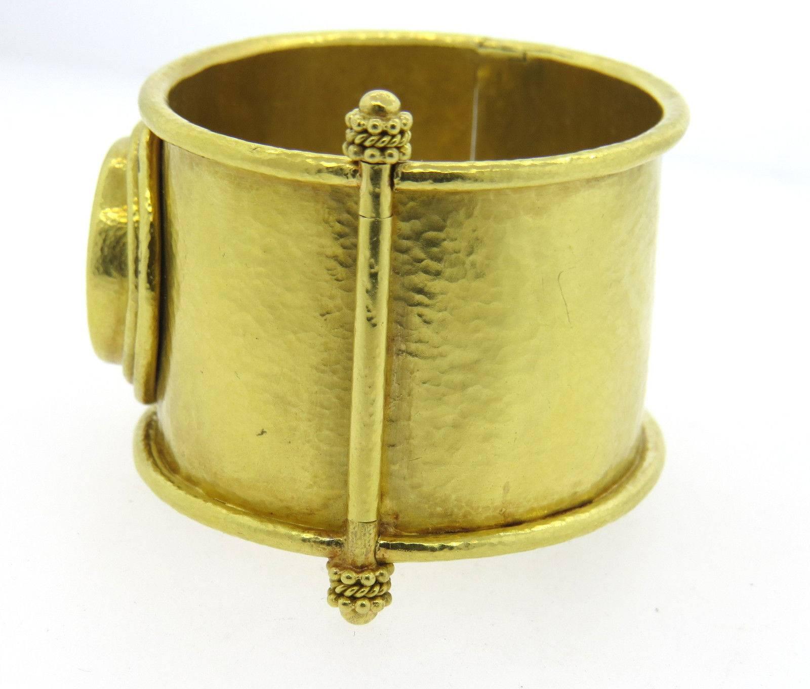 An  18k yellow gold bracelet set with an ancient coin.  Crafted by Elizabeth Locke, the bracelet will fit up to 6 1/2