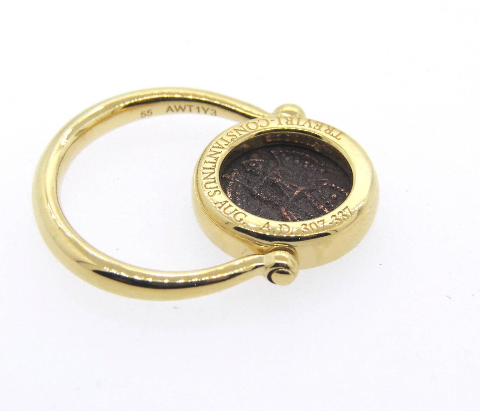 An 18k yellow gold ring set with a bronze ancient coin.  Crafted by Bulgari, the ring is a size 7, ring top is 15mm in diameter.  Marked: Bvlgari, Treviri-Constantinus, Aug A.D. 307-337, 750, made in Italy.  The weight of the ring is 8.3 grams.