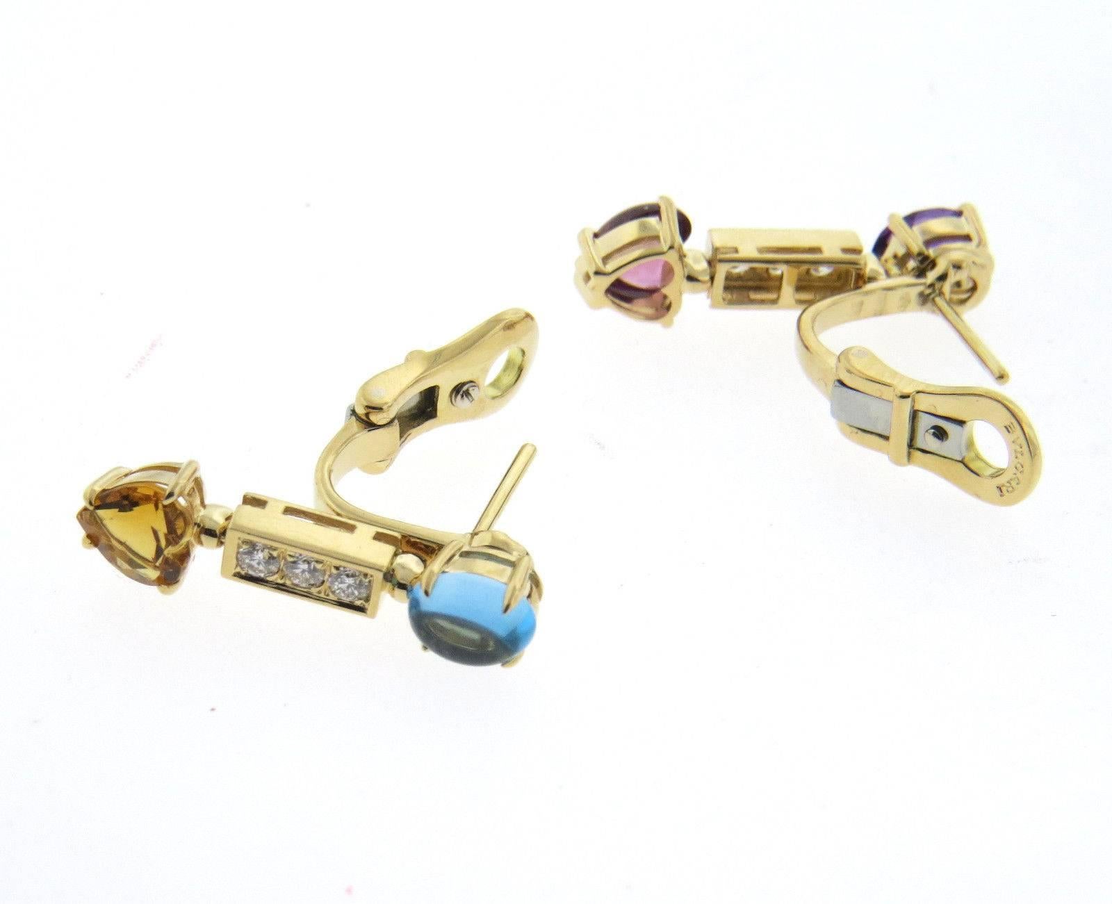 A pair of 18k yellow gold earrings set with approximately 0.18ctw of G/VS diamonds as well as topaz, citrine, amethyst, tourmaline.  The earrings are 25mm x 6.5mm and weigh 9.9 grams.  Marked: Bvlgari, made in Italy ,750.