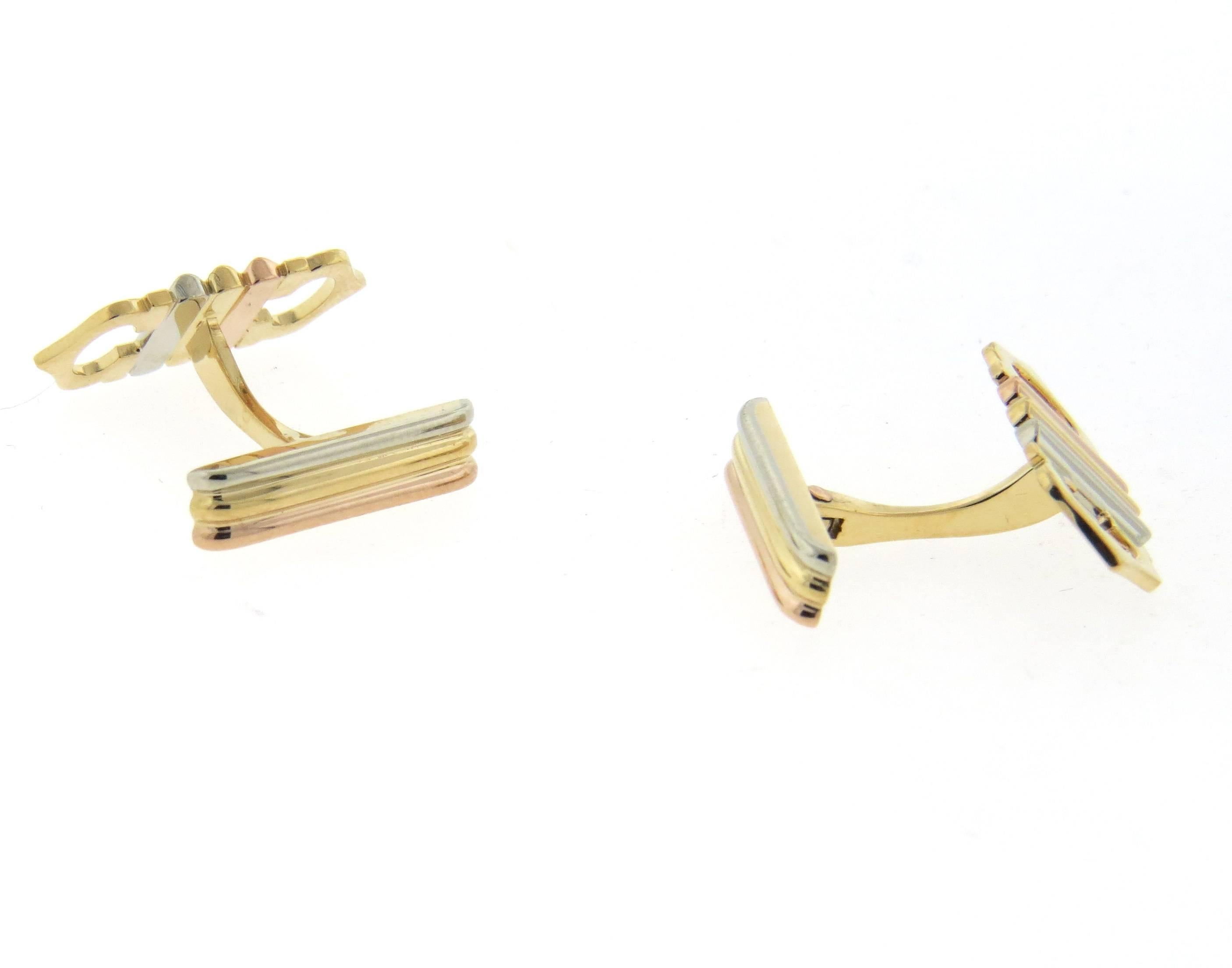 A pair of 18k tri color gold cufflinks, crafted by Cartier for Trinity collection. Each top measures 21mm x 10mm. Marked: Cartier, 750, 428244. Weight - 9.3 grams 