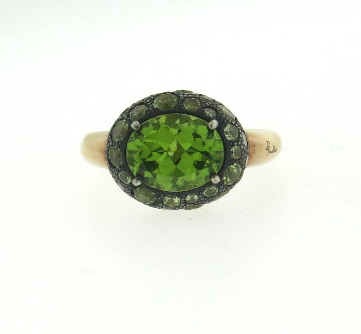 New Pomellato 18k rose gold and burnished silver ring, crafted by Tabou collection, set with peridot gemstones. Ring size - 6 1/4, ring top is 12.5mm x 15mm . Weight of the piece - 10 grams
Retail $4300