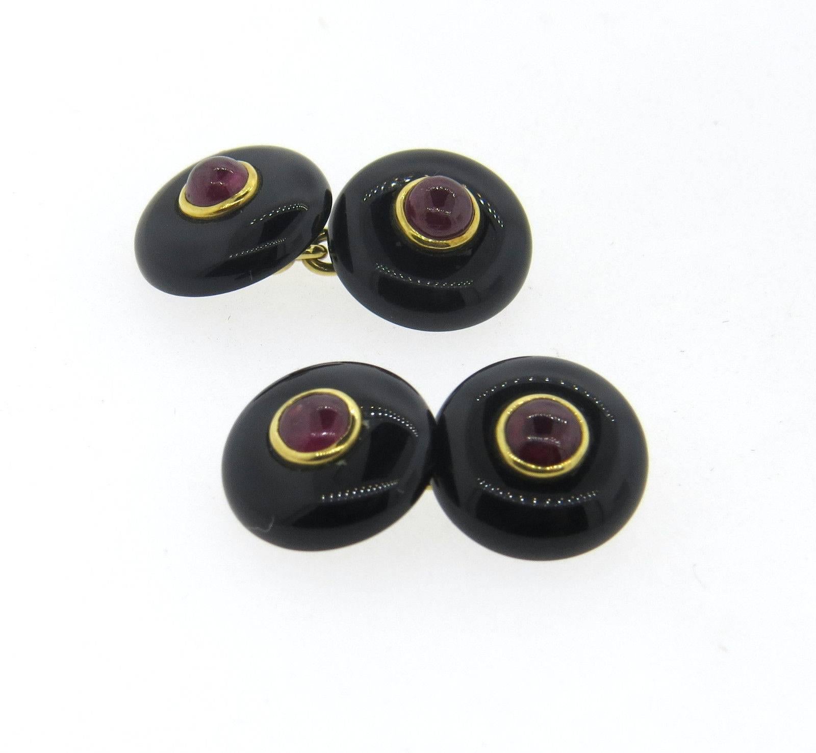 A pair of 18k gold Mid Century cufflinks, set with black onyx top and 4.2mm pigeon blood rubies. Each top is 13.1mm in diameter. Weight - 6.4 grams 