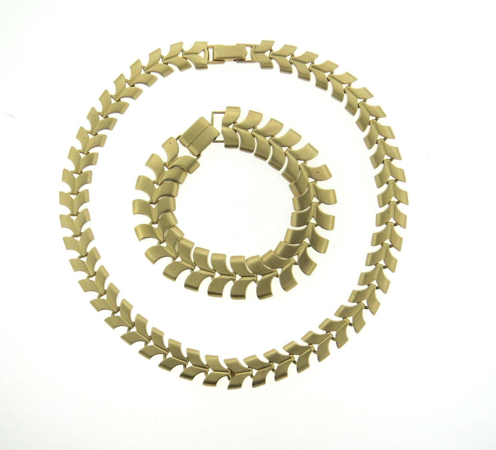A 14k yellow gold necklace and bracelet set by Tiffany & Co.  The necklace is 16 1/4
