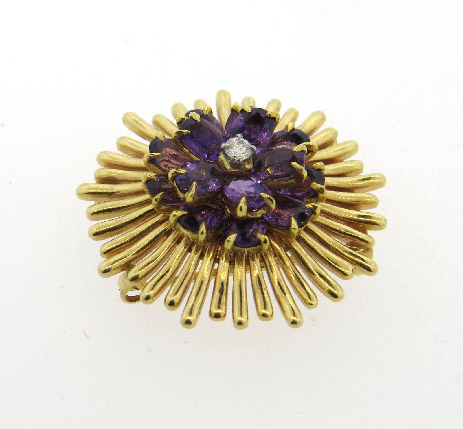 A 14k gold brooch pendant set with approximately 0.11ct of H/SI1 diamonds and amethyst. Brooch measures 31mm in diameter.  The weight of the piece is 19.6 grams. Can be worn as a slide /enhancer on the necklace. 
