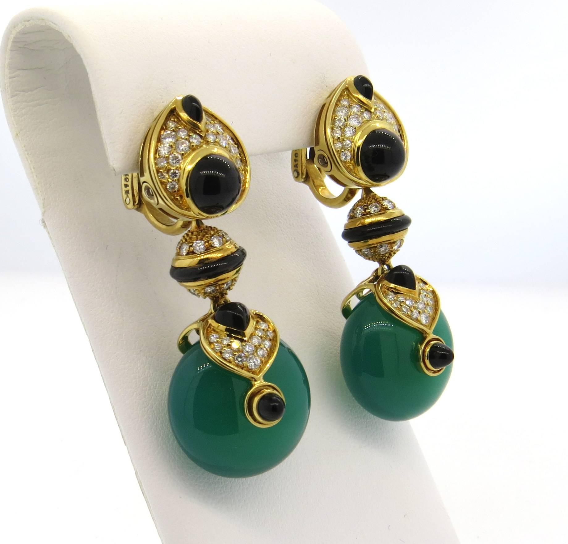 A pair of impressive 18k yellow gold drop earrings, crafted by Marina B, featuring four pairs of multi color interchangeable 20mm crystal drops. Earrings are decorated with black jade and approx. 1.75ctw in G/VS diamonds. Earrings are 50mm long.