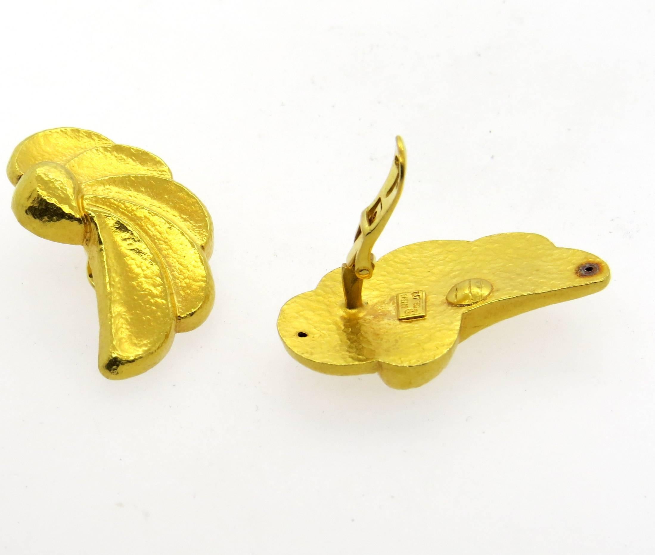 A pair of large 18 hammered gold earrings, featuring wings motif design, crafted by Greek designer Ilias Lalaounis. Earrings measure 39mm x 23mm . Marked: 750, Greece, Maker's hallmark 117. Weight - 27.5 grams 