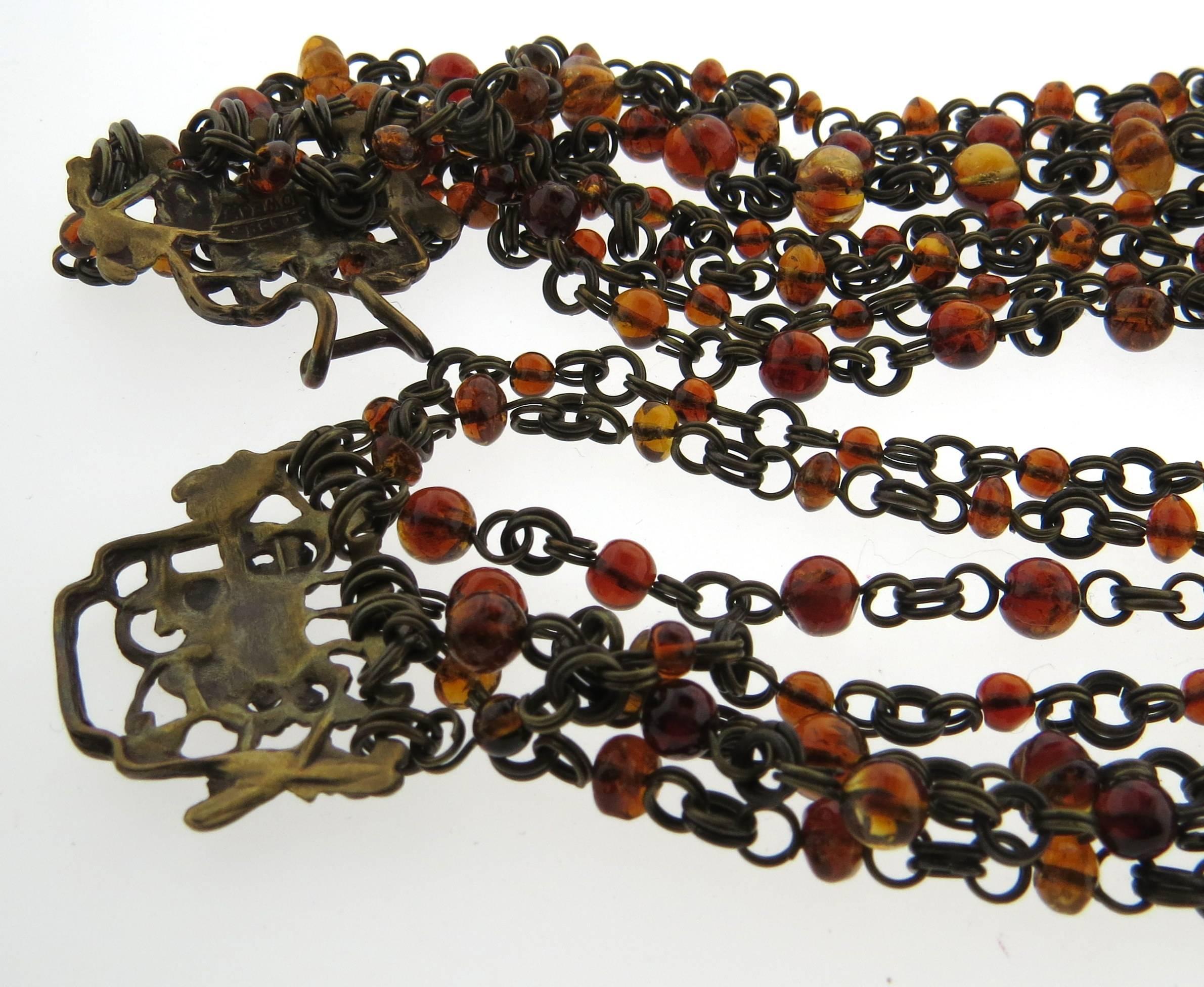 One of a kind bronze multi stand necklace, crafted by Stephen Dweck, set with amber stones. Necklace is 17