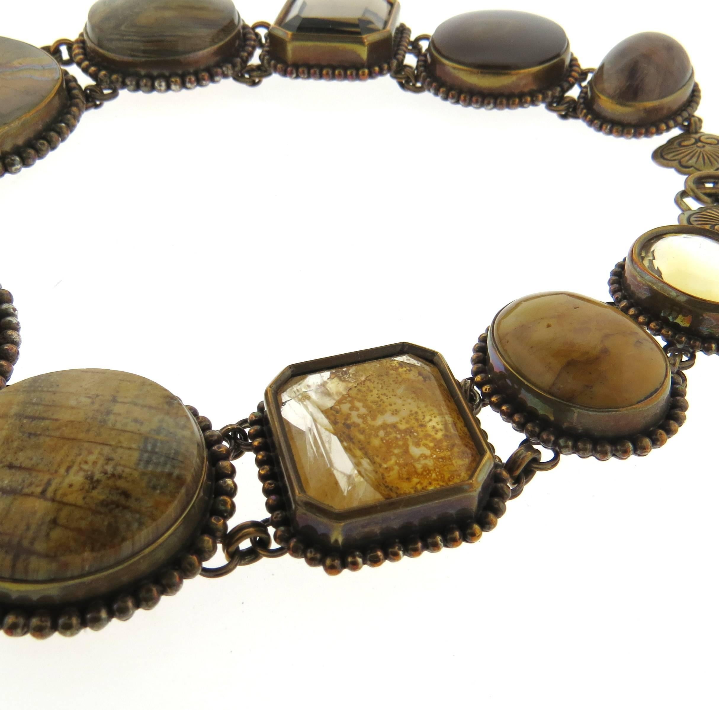 Large bronze necklace, crafted by Stephen Dweck, decorated with multi semi precious gemstones, amber and fossils. Necklace is 18