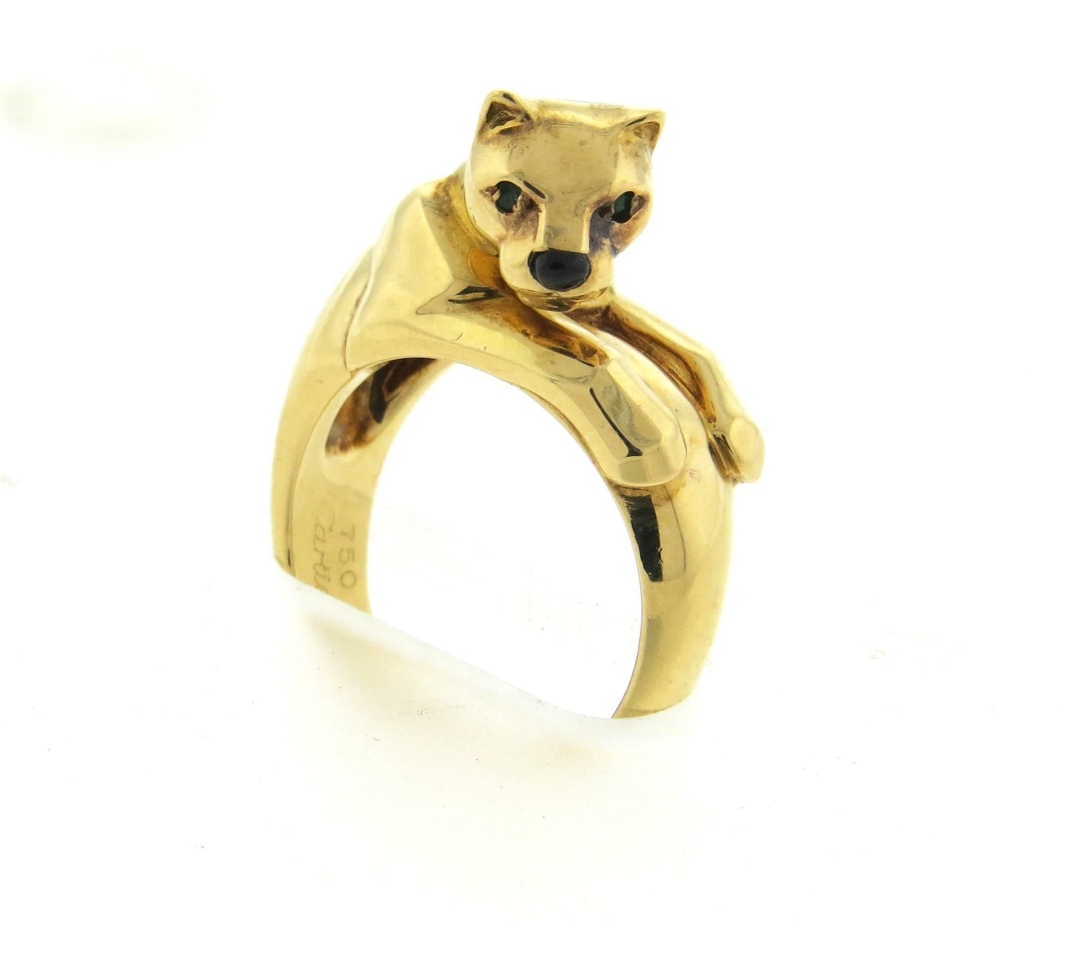 18k yellow gold panther ring, crafted by Cartier for Panthere collection, decorated with black onyx nose and emerald eyes. Ring size 6, ring top is 10mm wide and sits approx. 11mm from the finger top. Marked:  	750, Cartier, 52, 900822. Weight of